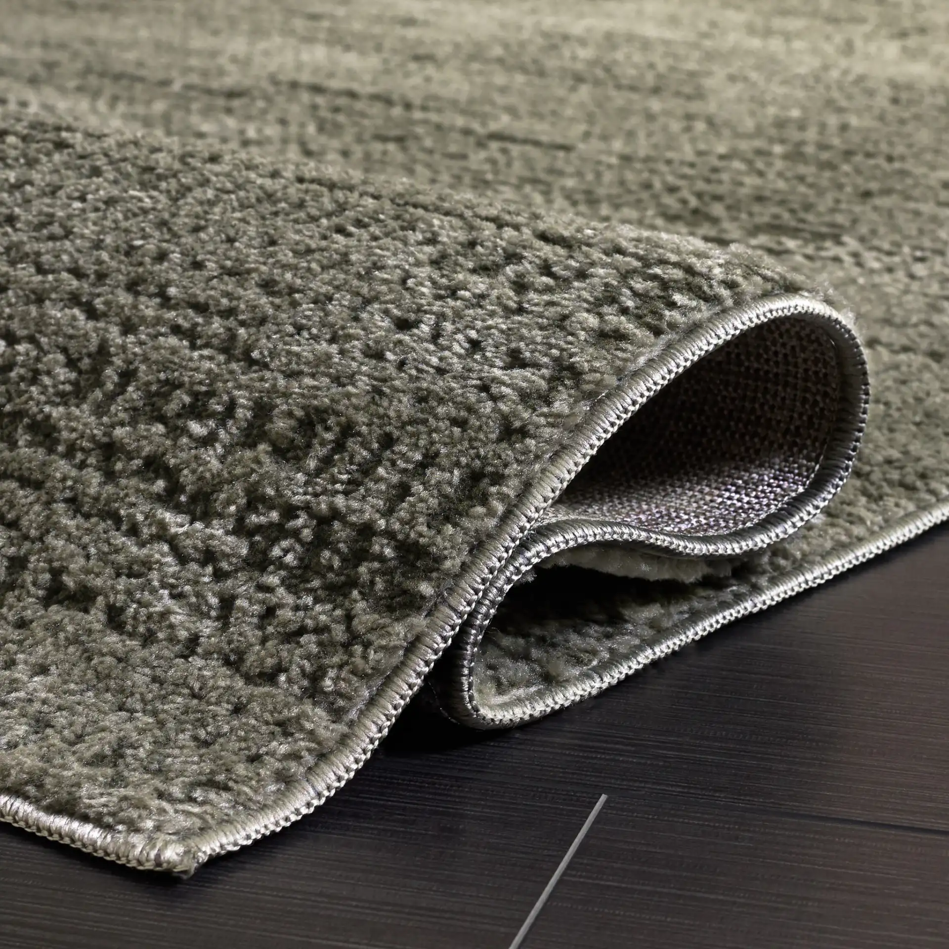 Lunara Modern Ribbed Rug in Green / Dark Green in a styled room