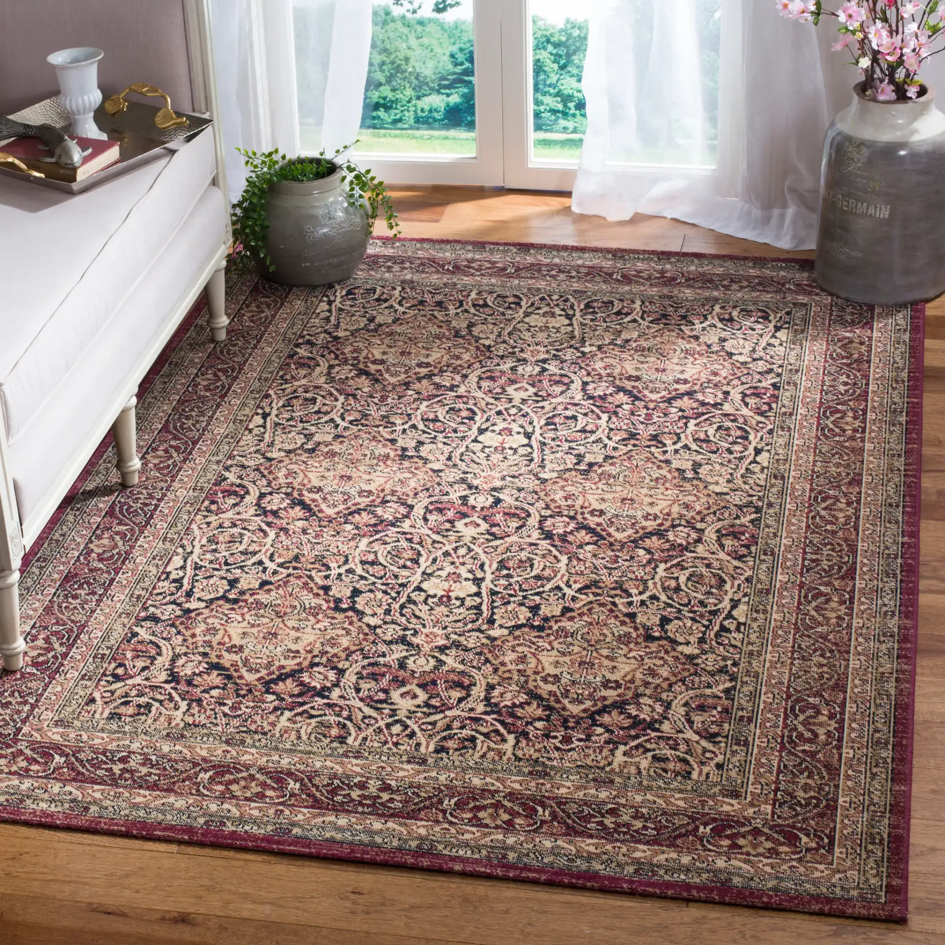 Lavar Kerman Arabesque Bordered Rug in Navy / Red in a styled room
