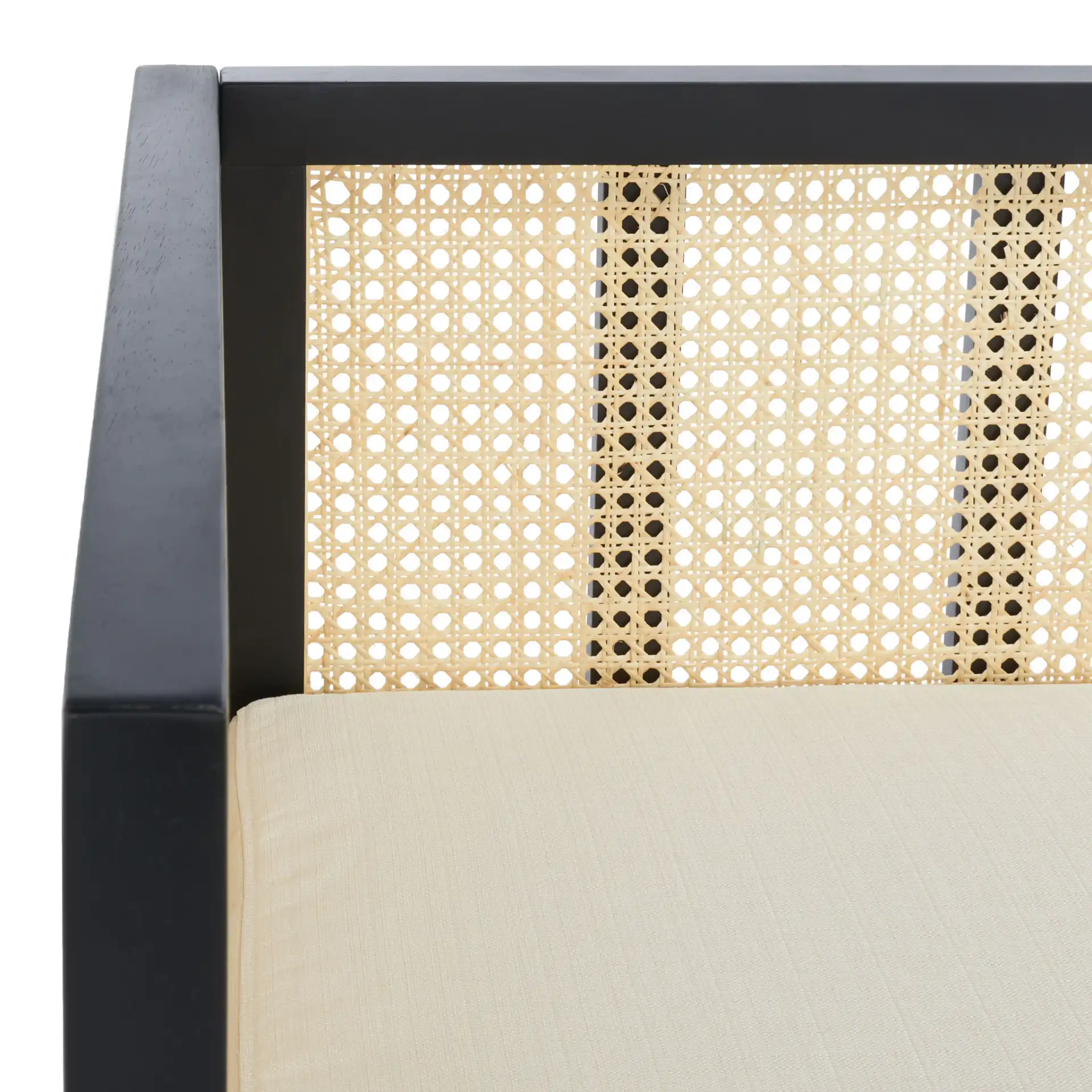 Maude Rattan Three-Seater Sofa in Black in a styled room