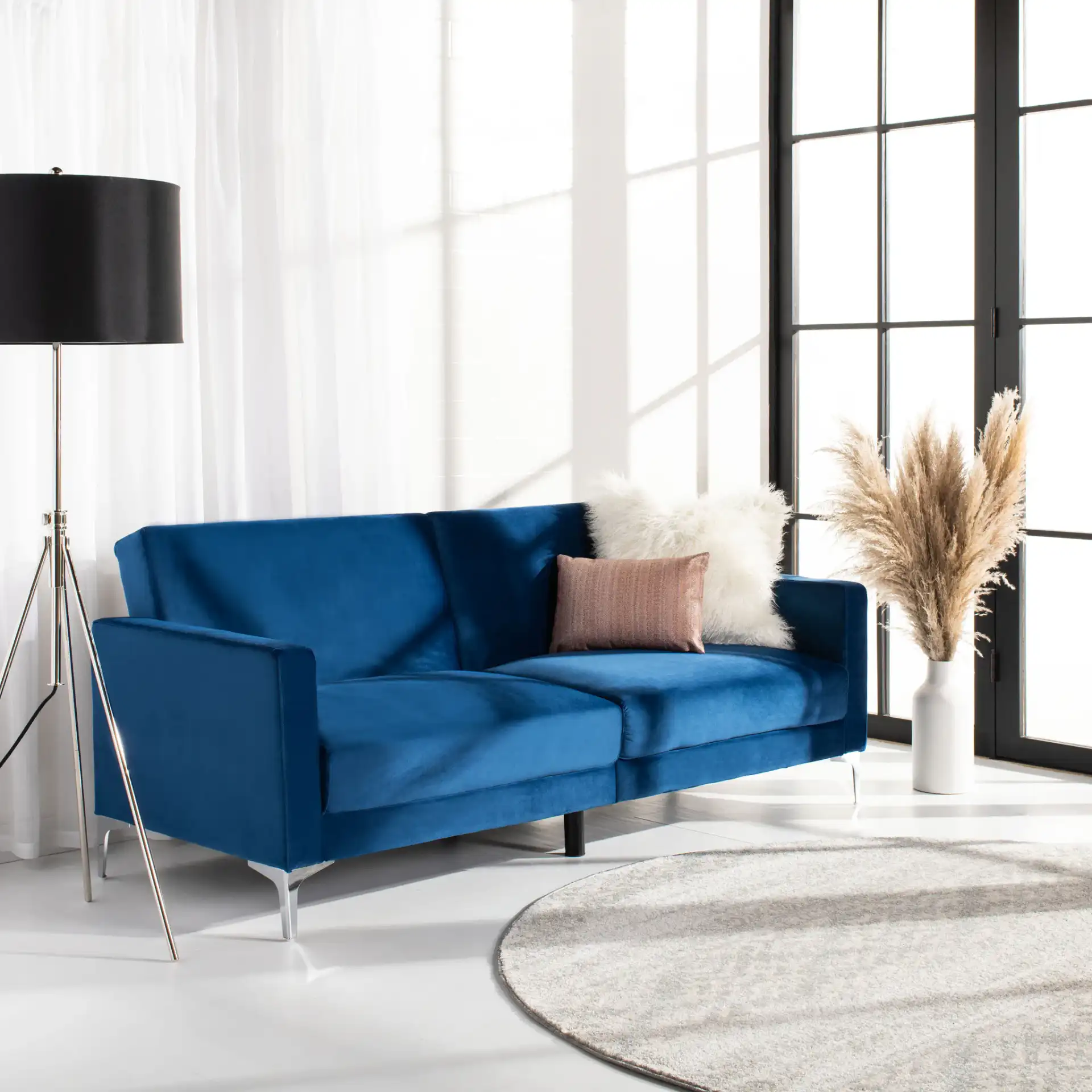 Chelsea Foldable Futon Bed in Cognac / Chrome in a styled room