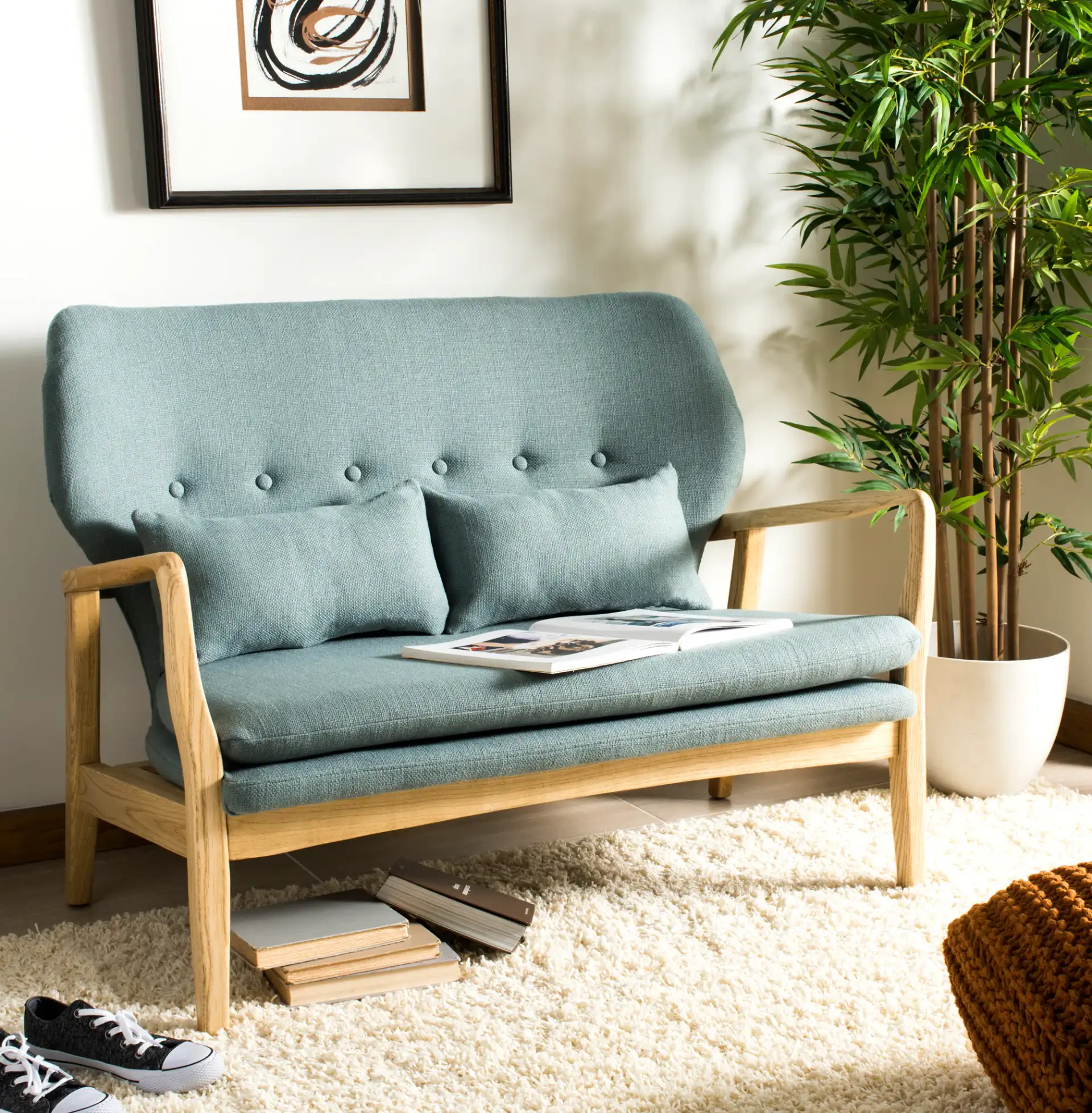 Ellaria Loveseat With Bench in Blue / Natural in a styled room