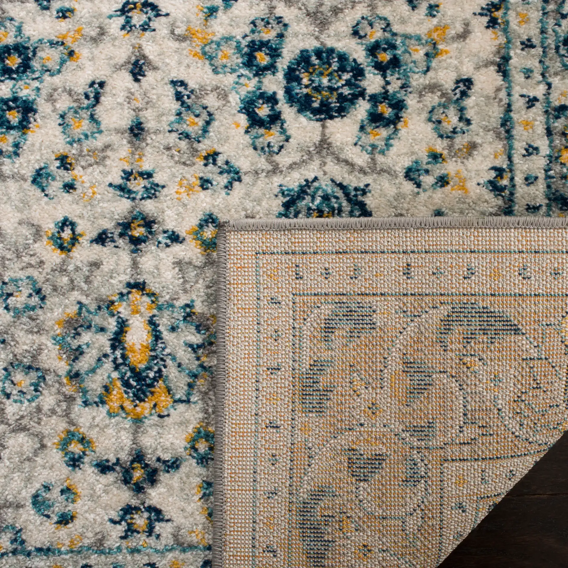 Madison Floral Bordered Rug in Ivory / Navy in a styled room