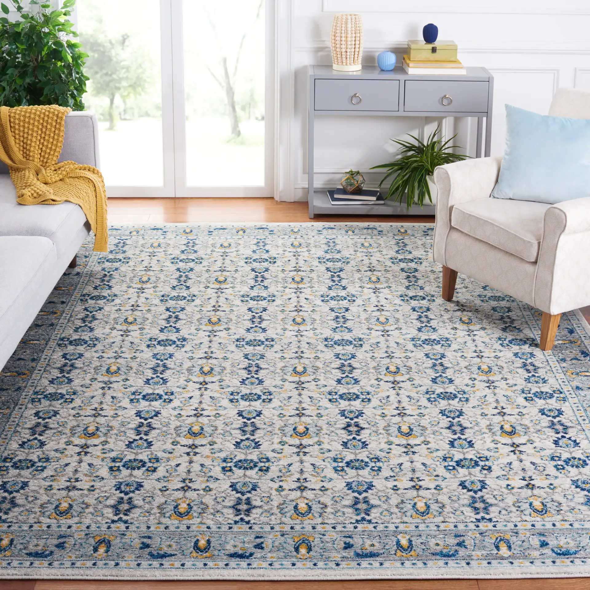 Madison Floral Bordered Rug in Ivory / Navy in a styled room