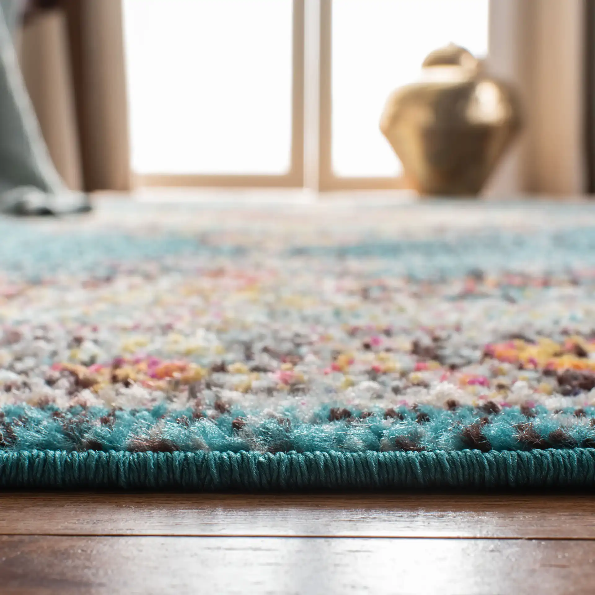 Madison Medallion Bordered Rug in Navy / Turquoise in a styled room