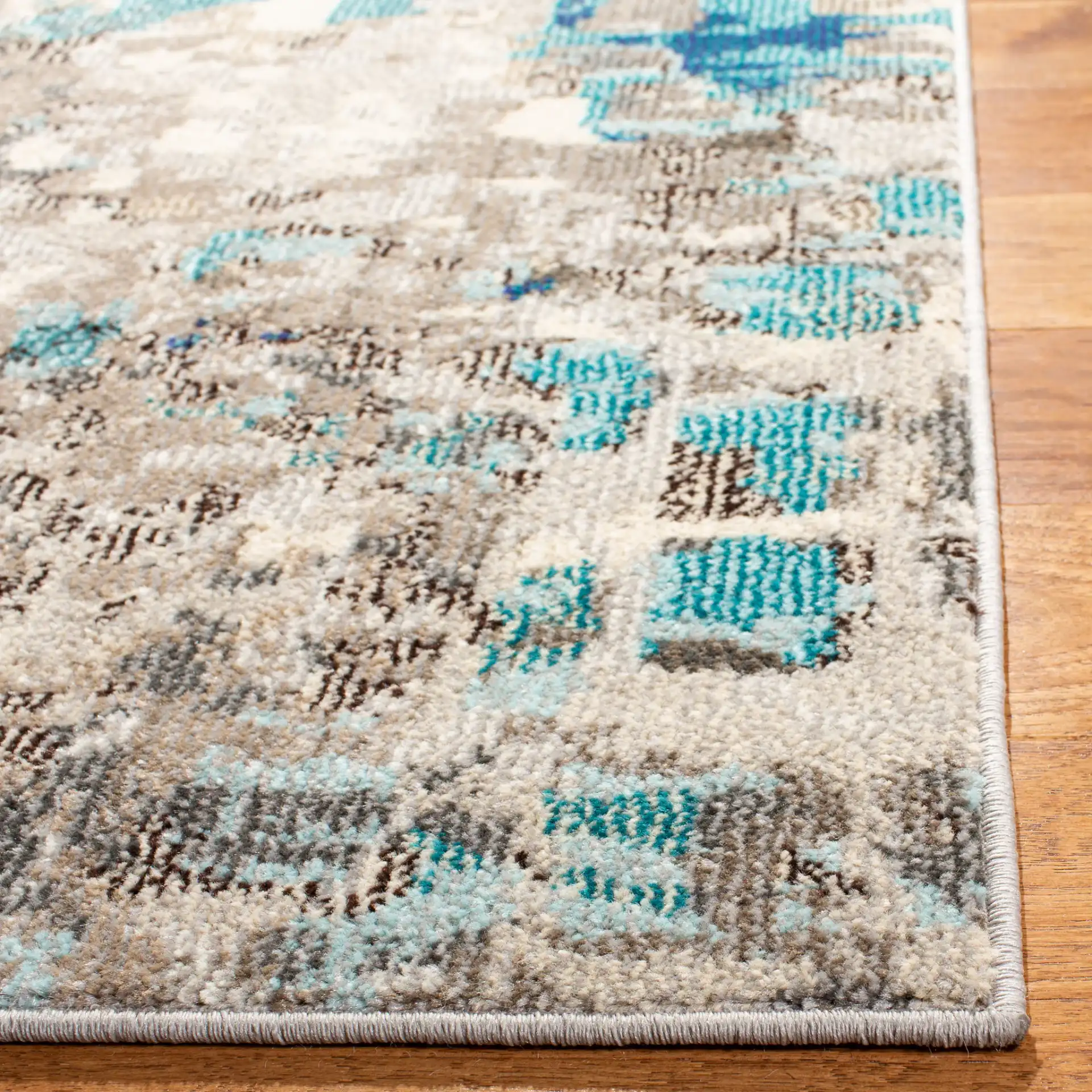Madison Abstract Rug in Gray / Blue in a styled room