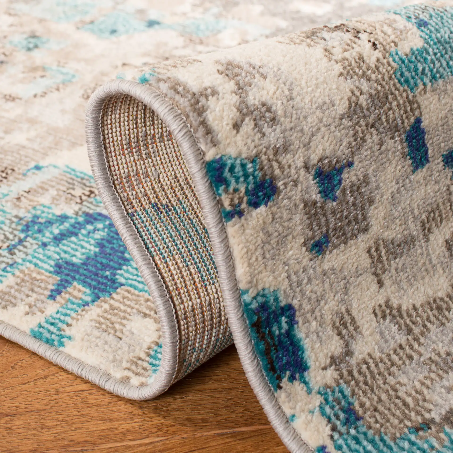 Madison Abstract Rug in Gray / Blue in a styled room