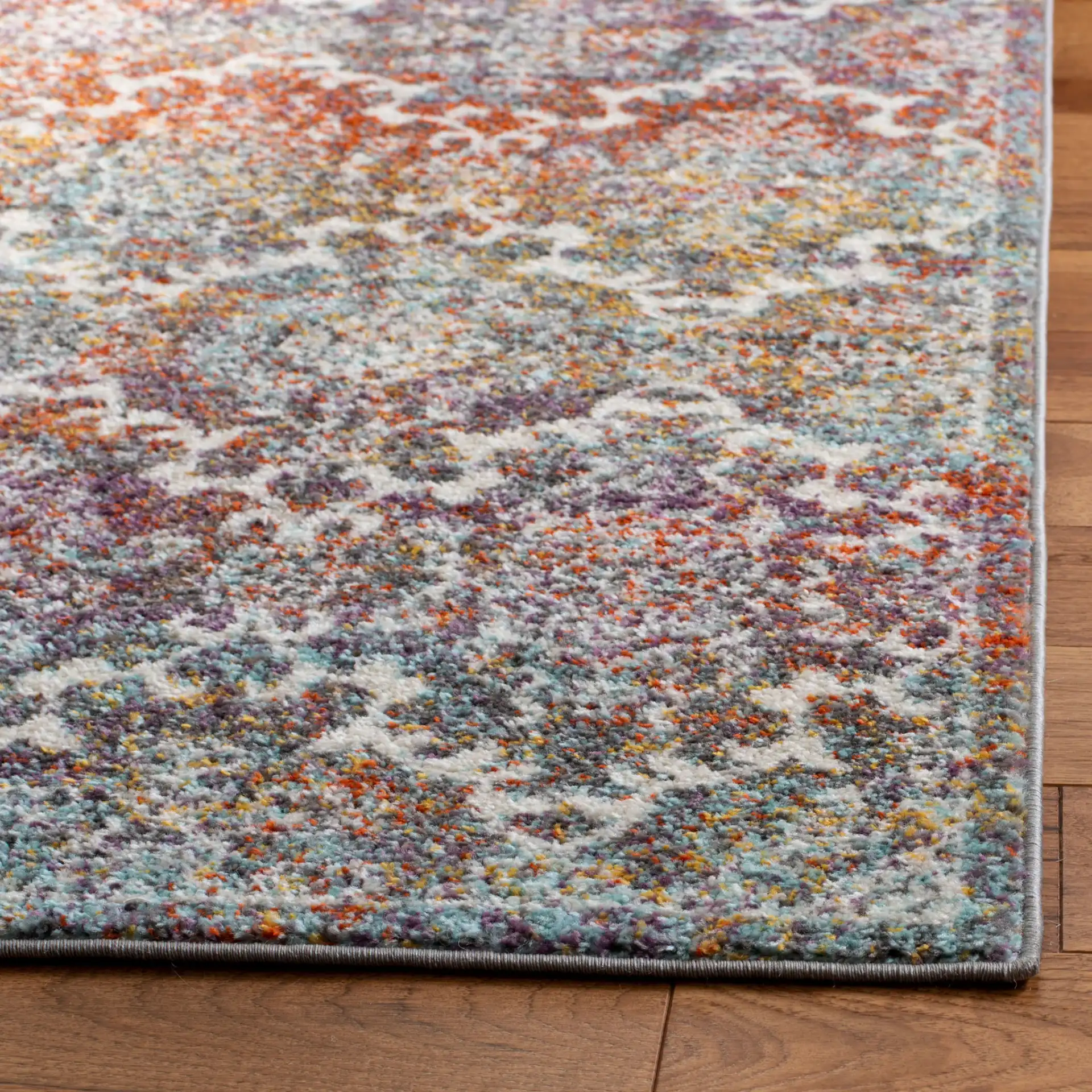 Madison Damask Rug in Light Gray / Rust in a styled room