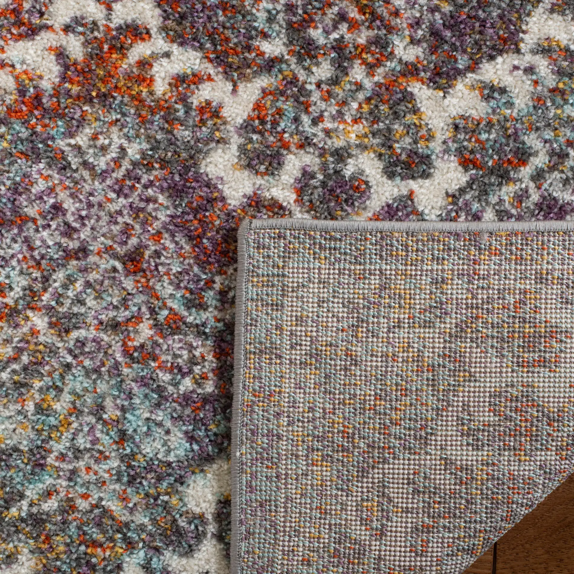 Madison Damask Rug in Light Gray / Rust in a styled room