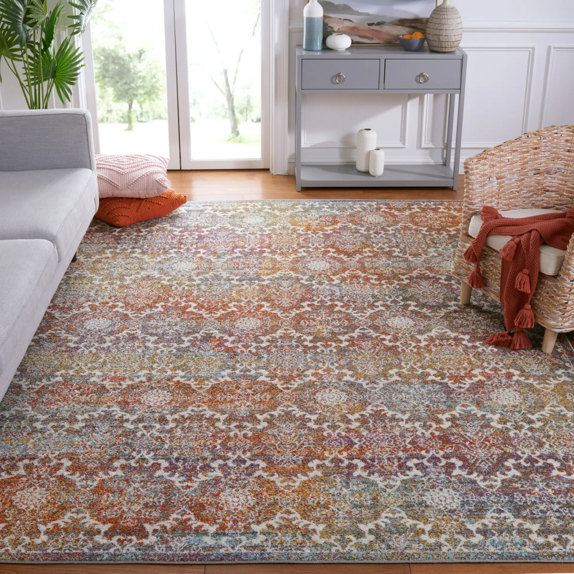 Madison Damask Rug in Light Gray / Rust in a styled room