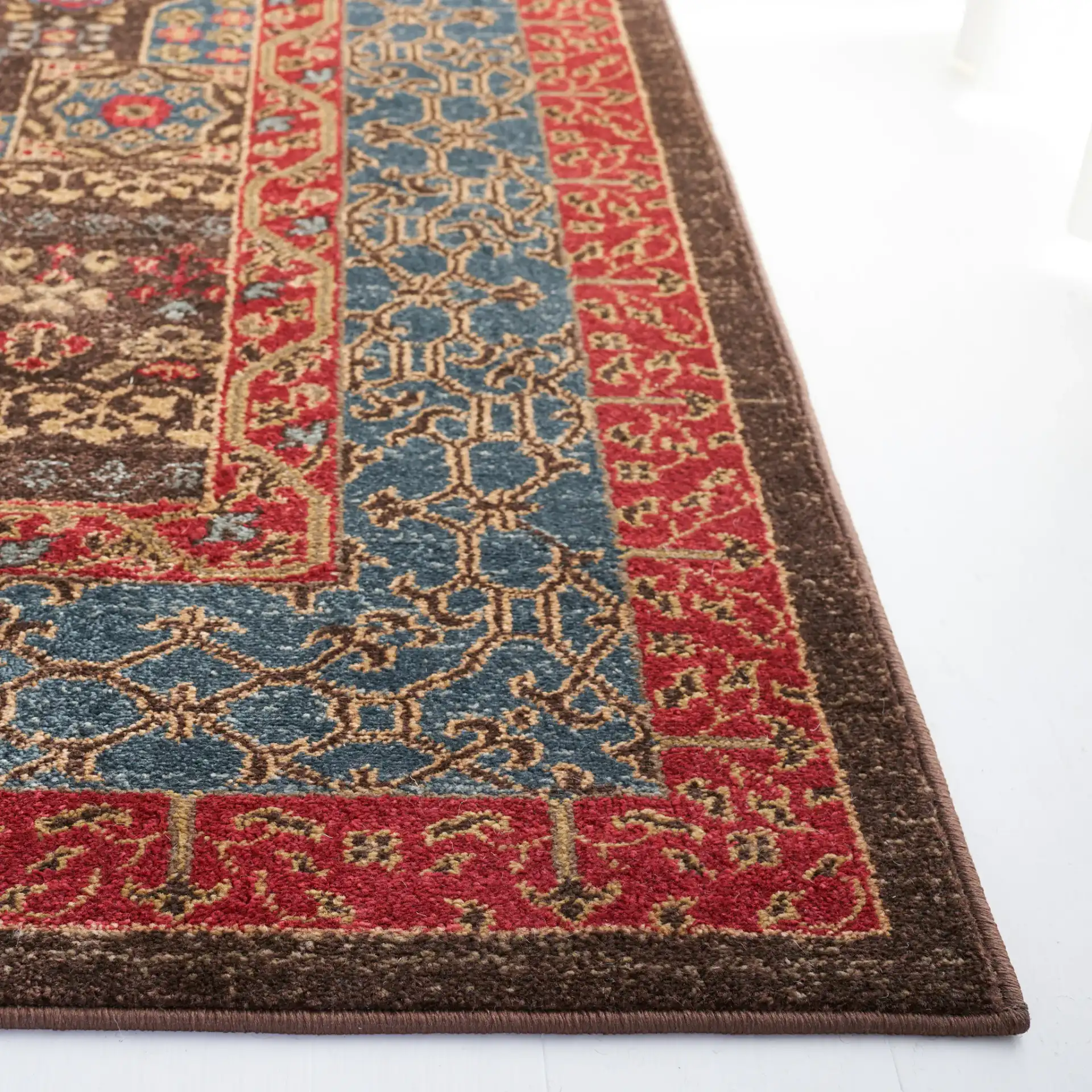 Mahal Medallion Rug in Navy / Red in a styled room