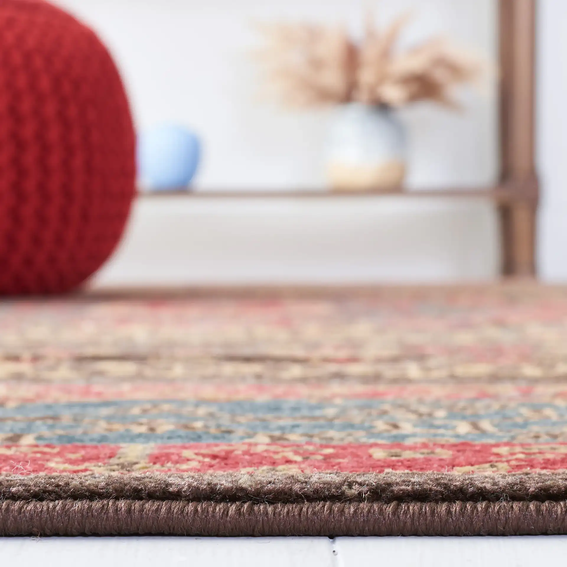 Mahal Medallion Rug in Navy / Red in a styled room