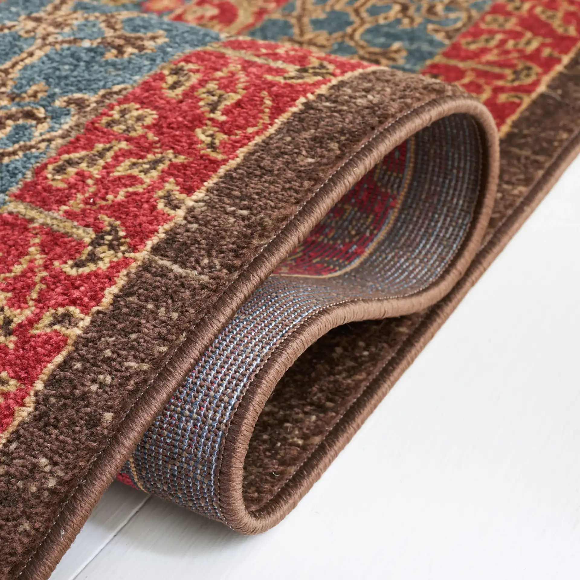 Mahal Medallion Rug in Navy / Red in a styled room