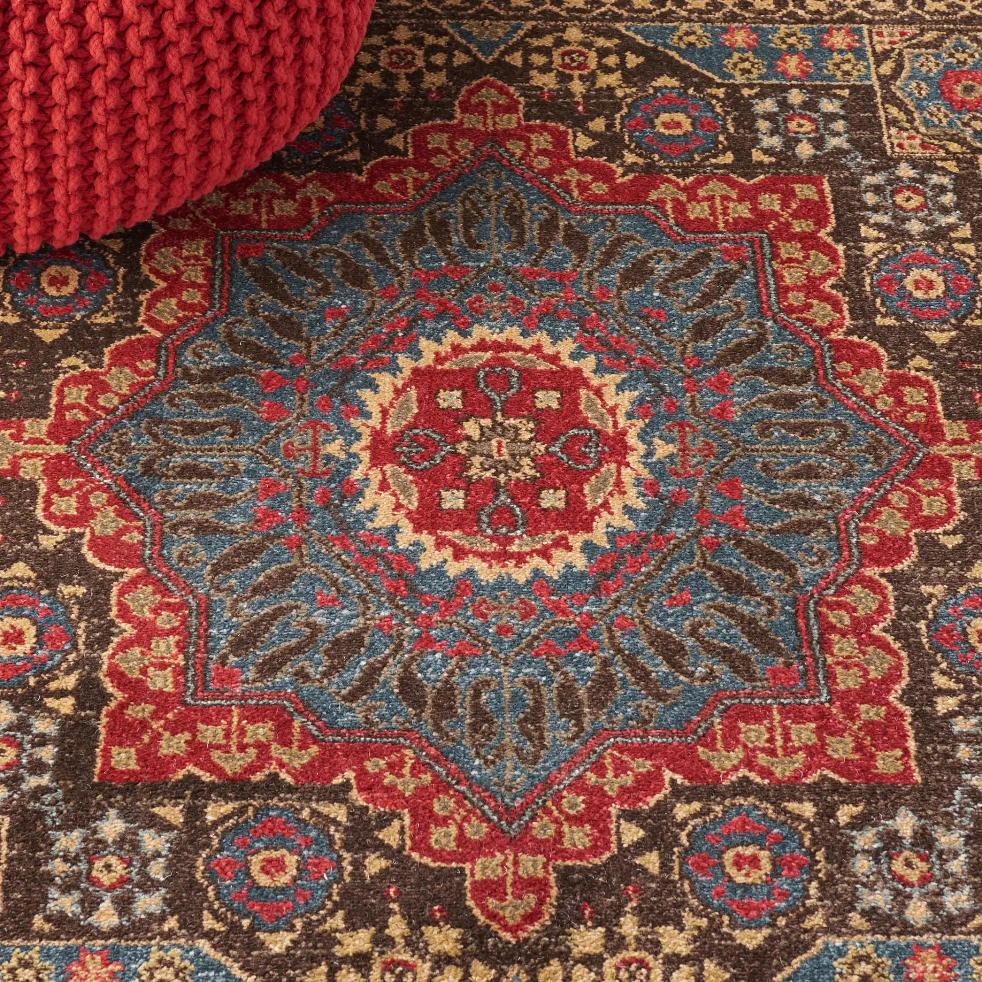 Mahal Medallion Rug in Navy / Red in a styled room