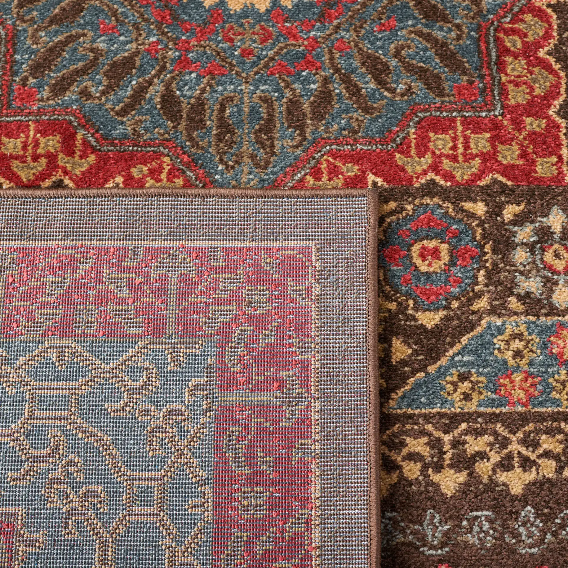 Mahal Medallion Rug in Navy / Red in a styled room