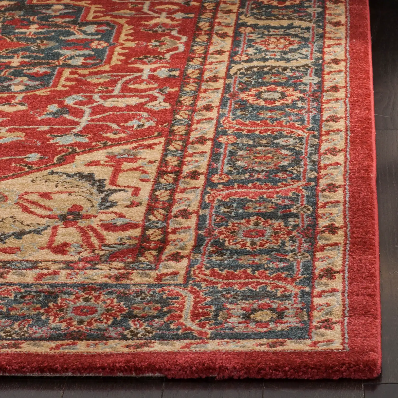 Mahal Persian Medallion Bordered Rug in Navy / Red in a styled room