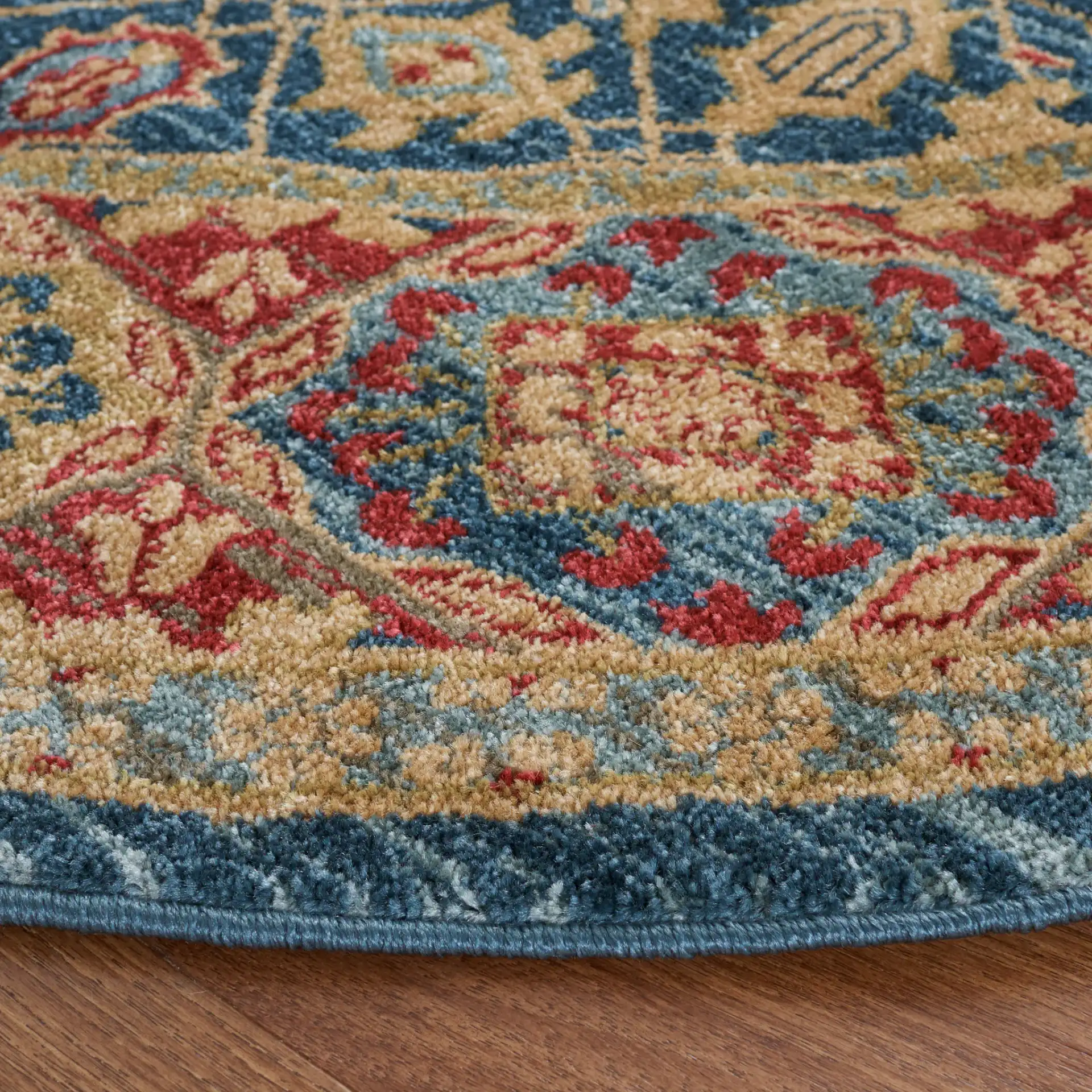 Mahal Lattice Bordered Rug in Light Blue / Red in a styled room