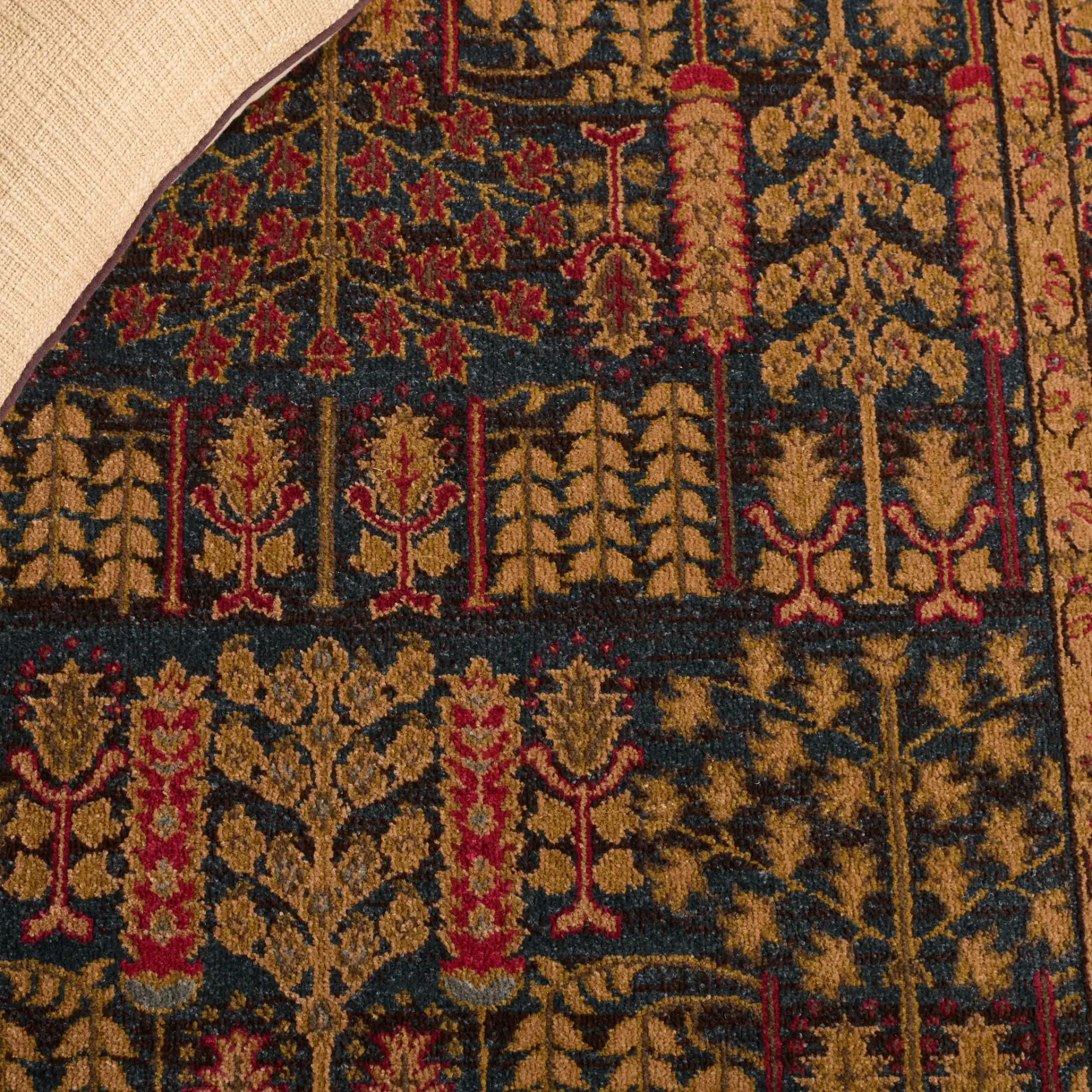 Mahal Botanical Bordered Rug in Navy / Natural in a styled room