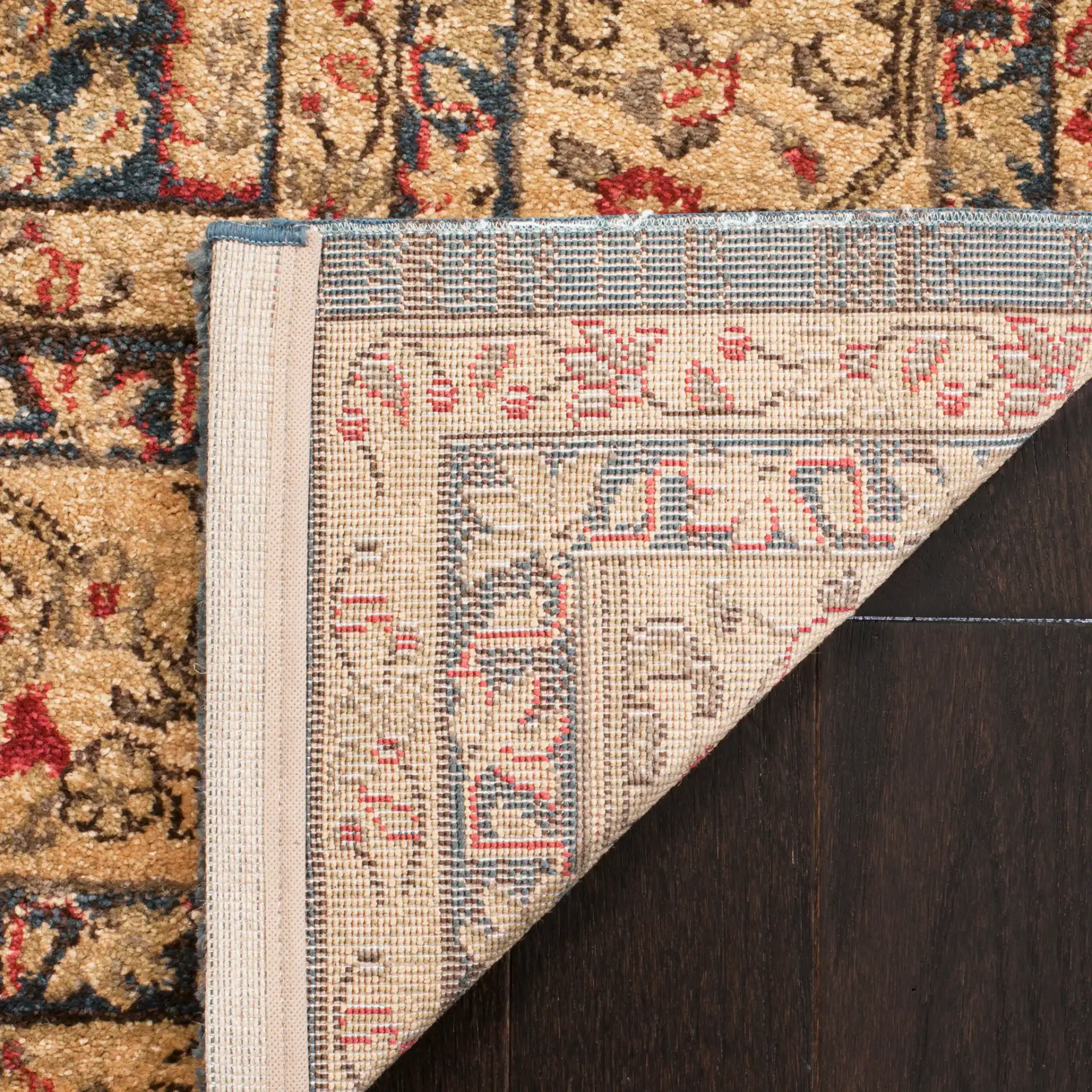 Mahal Botanical Bordered Rug in Navy / Natural in a styled room
