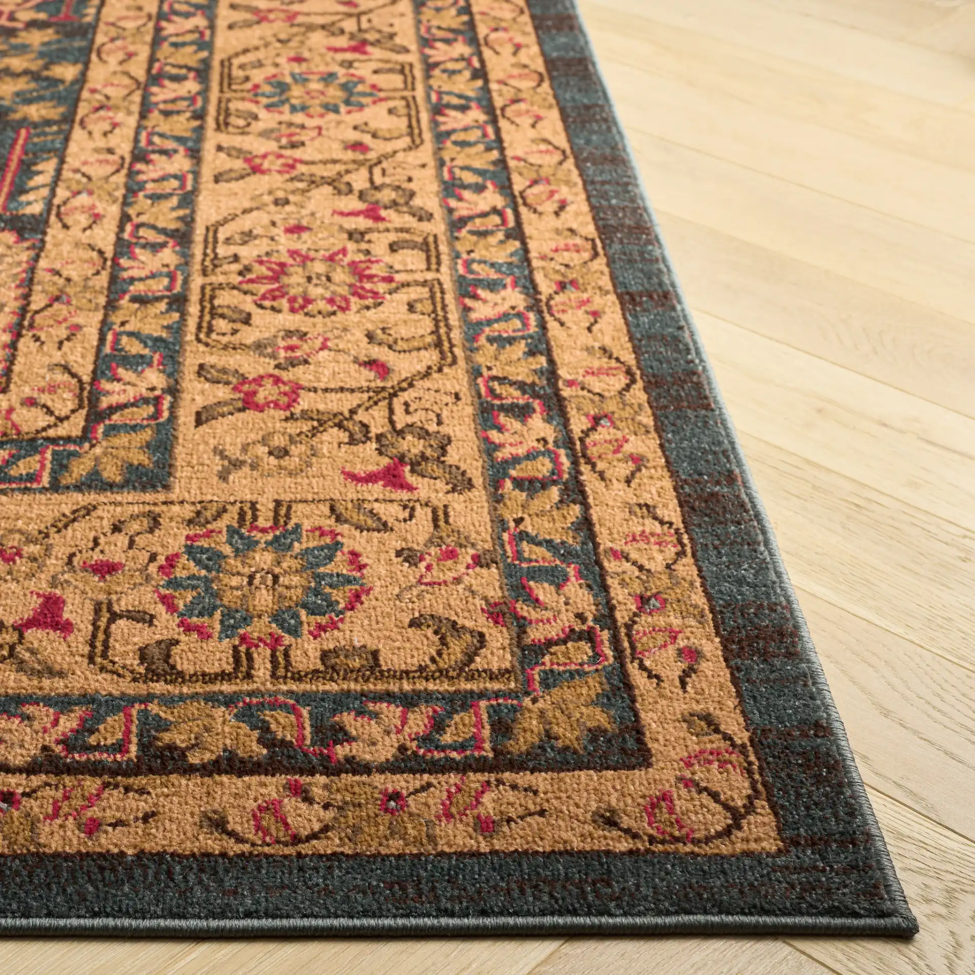 Mahal Botanical Bordered Rug in Navy / Natural in a styled room