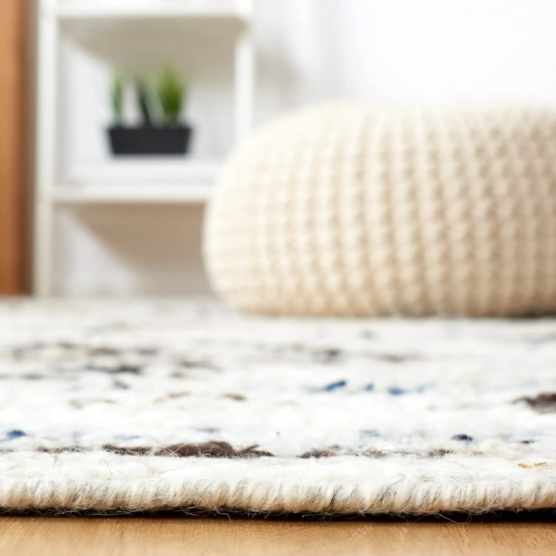 Manhattan Tribal Diamond Hand-Woven Wool Rug in Ivory / Charcoal in a styled room