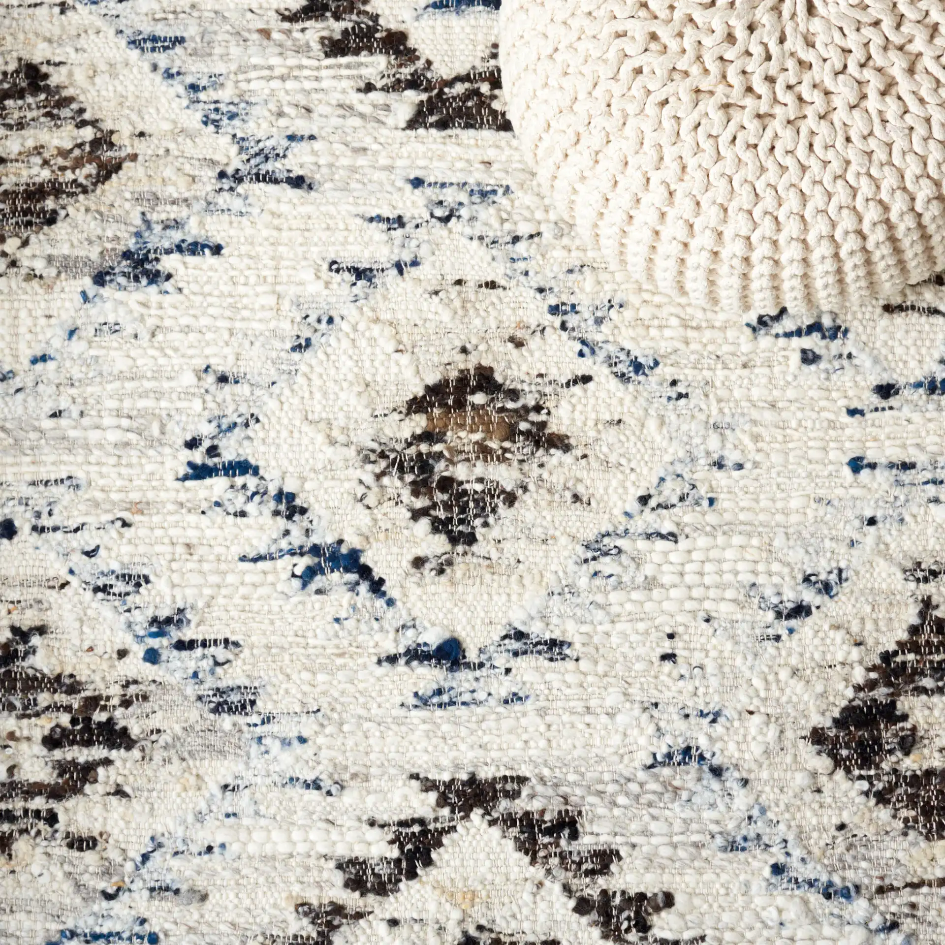 Manhattan Tribal Diamond Hand-Woven Wool Rug in Ivory / Charcoal in a styled room