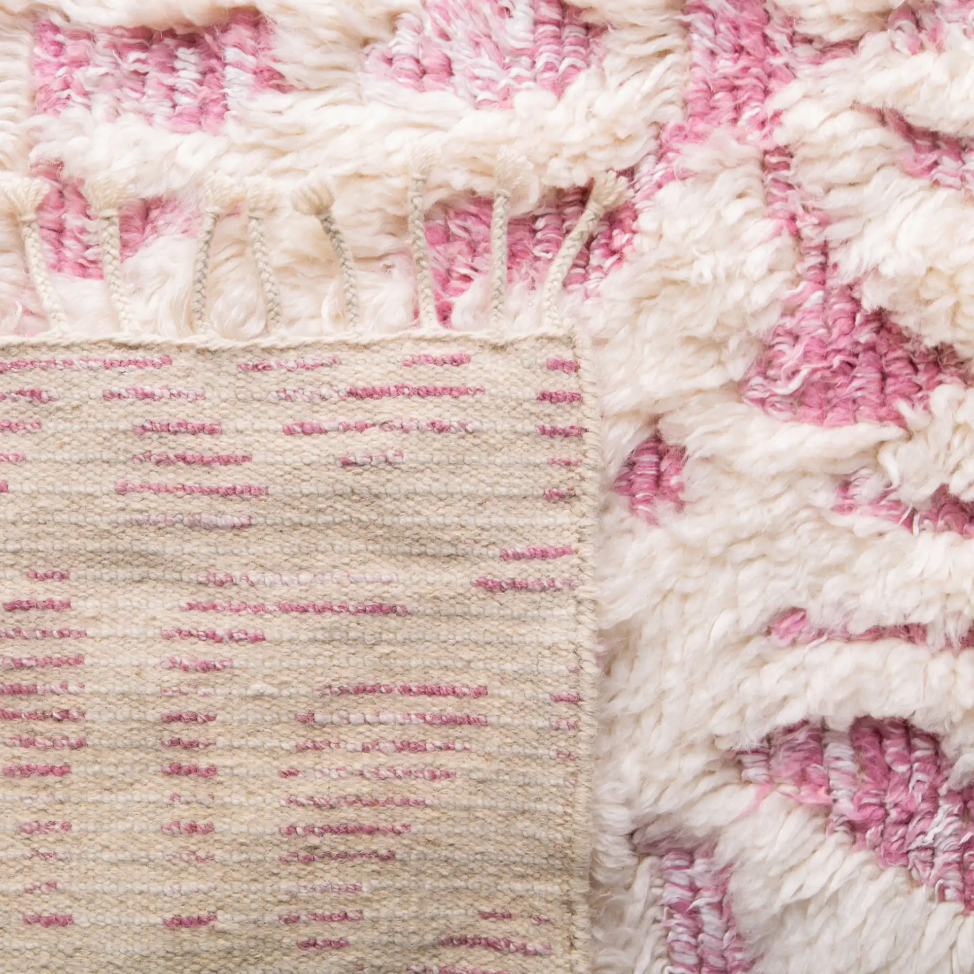 Manhattan Tribal Lattice Hand-Knotted Wool Rug in Ivory / Pink in a styled room