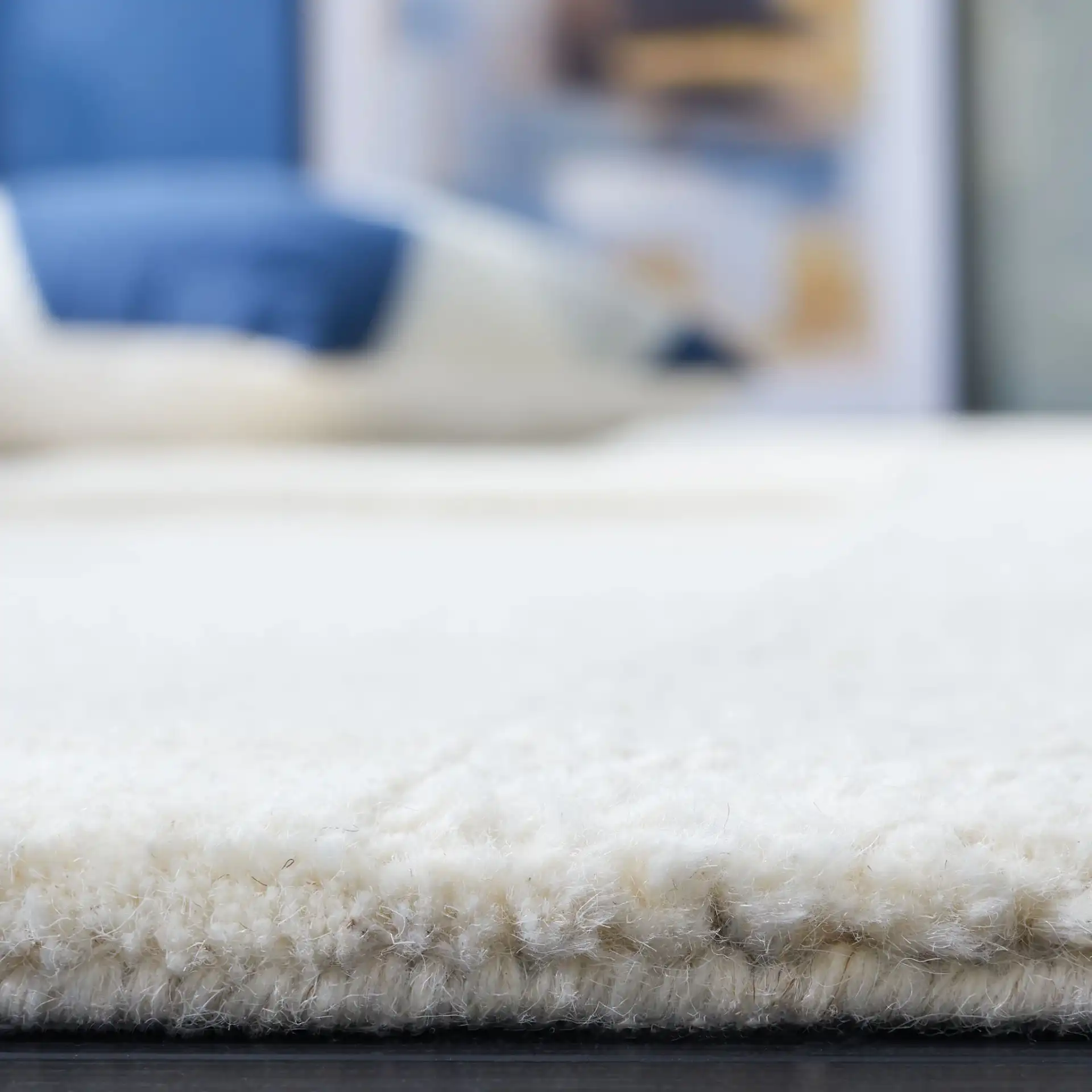 Manhattan Patchwork Hand-Tufted Wool Rug in Ivory / Beige in a styled room