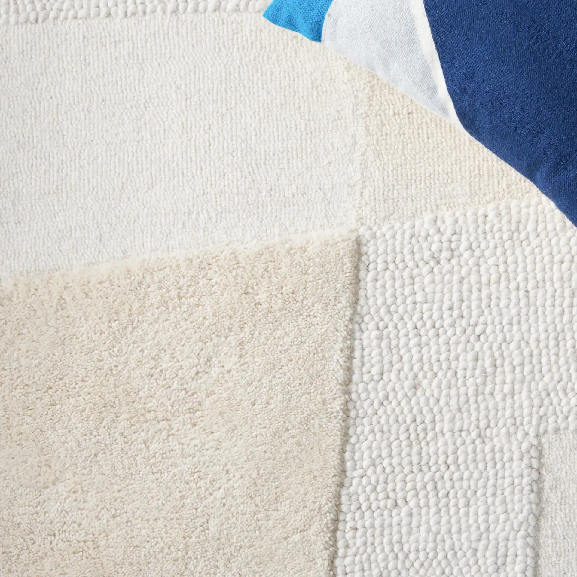 Manhattan Patchwork Hand-Tufted Wool Rug in Ivory / Beige in a styled room