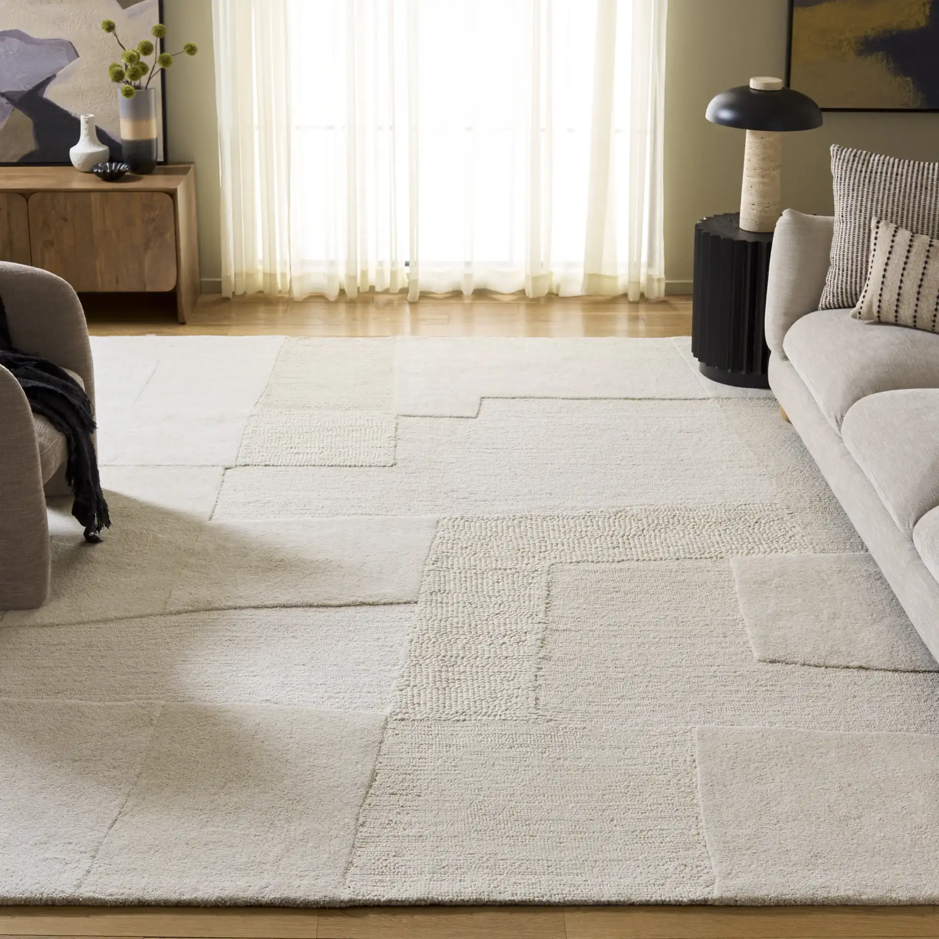 Manhattan Patchwork Hand-Tufted Wool Rug in Ivory / Beige in a styled room