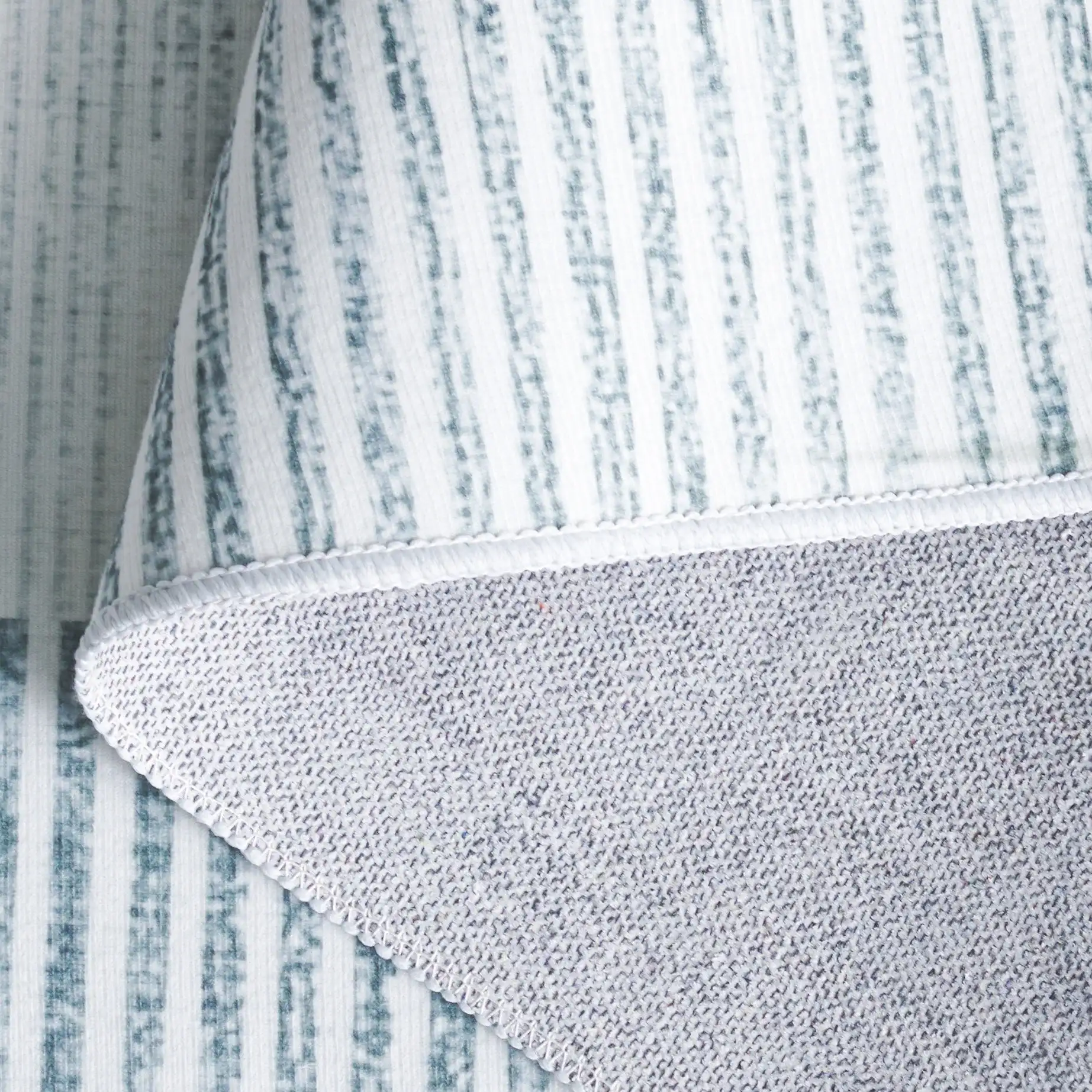 Malibu Striped Border Washable Rug in Ivory / Gray in a styled room