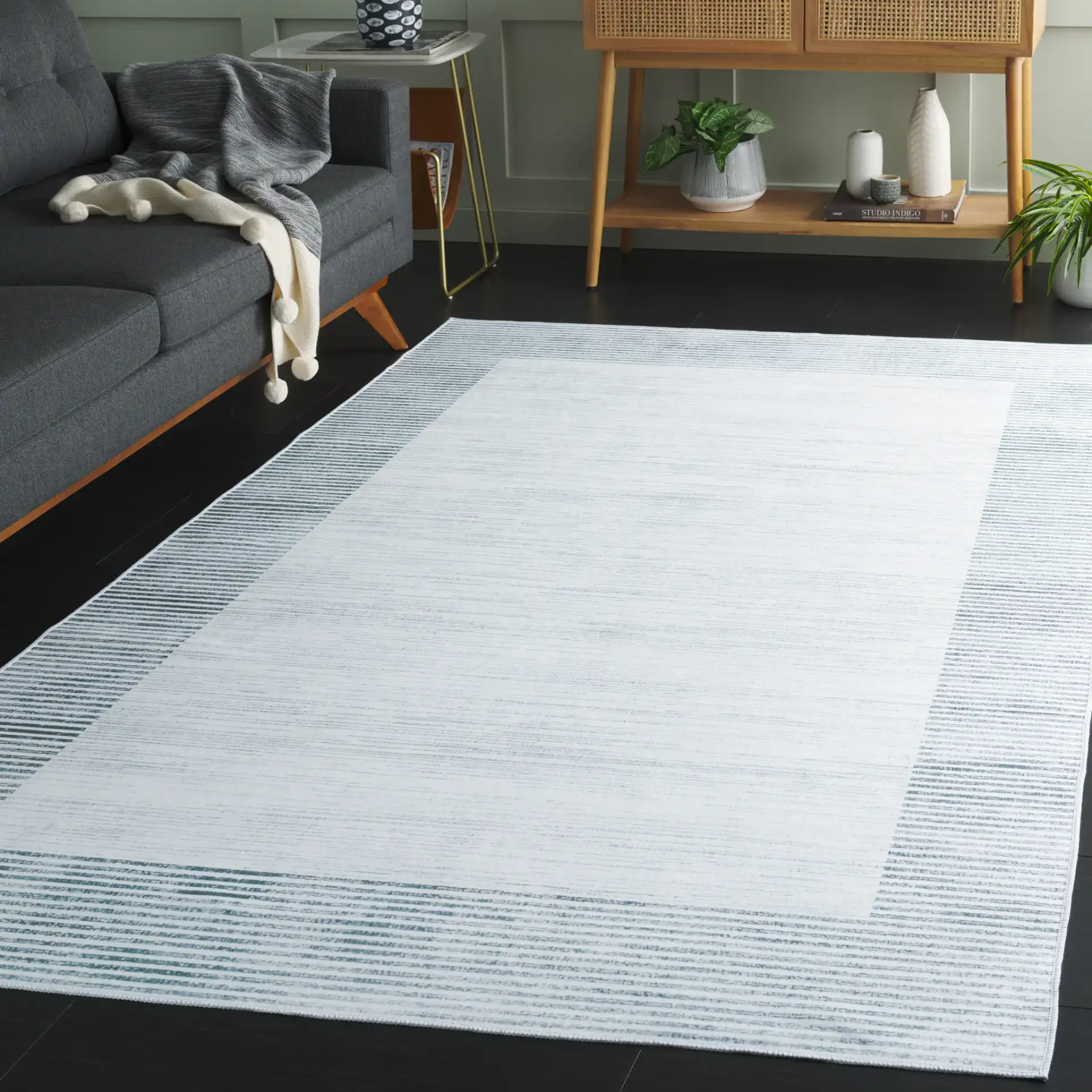 Malibu Striped Border Washable Rug in Ivory / Gray in a styled room