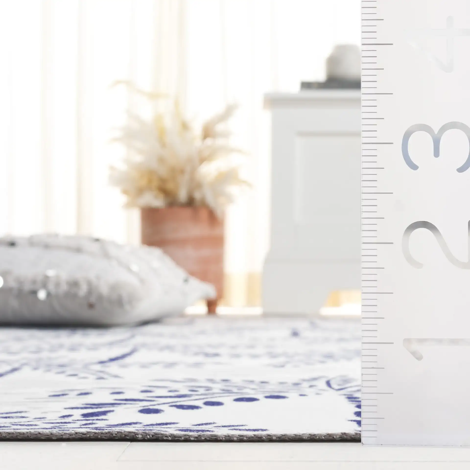 Malibu Palm Tree Washable Rug in Ivory / Navy in a styled room