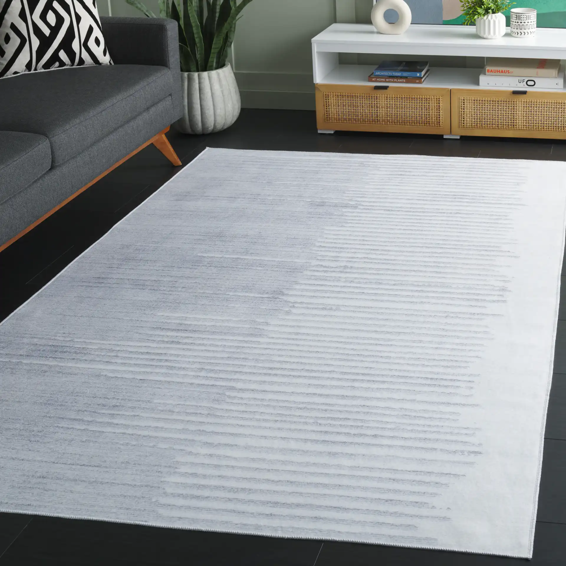 Malibu Gradient Stripe Washable Rug in Light Gray / Gray in a styled room