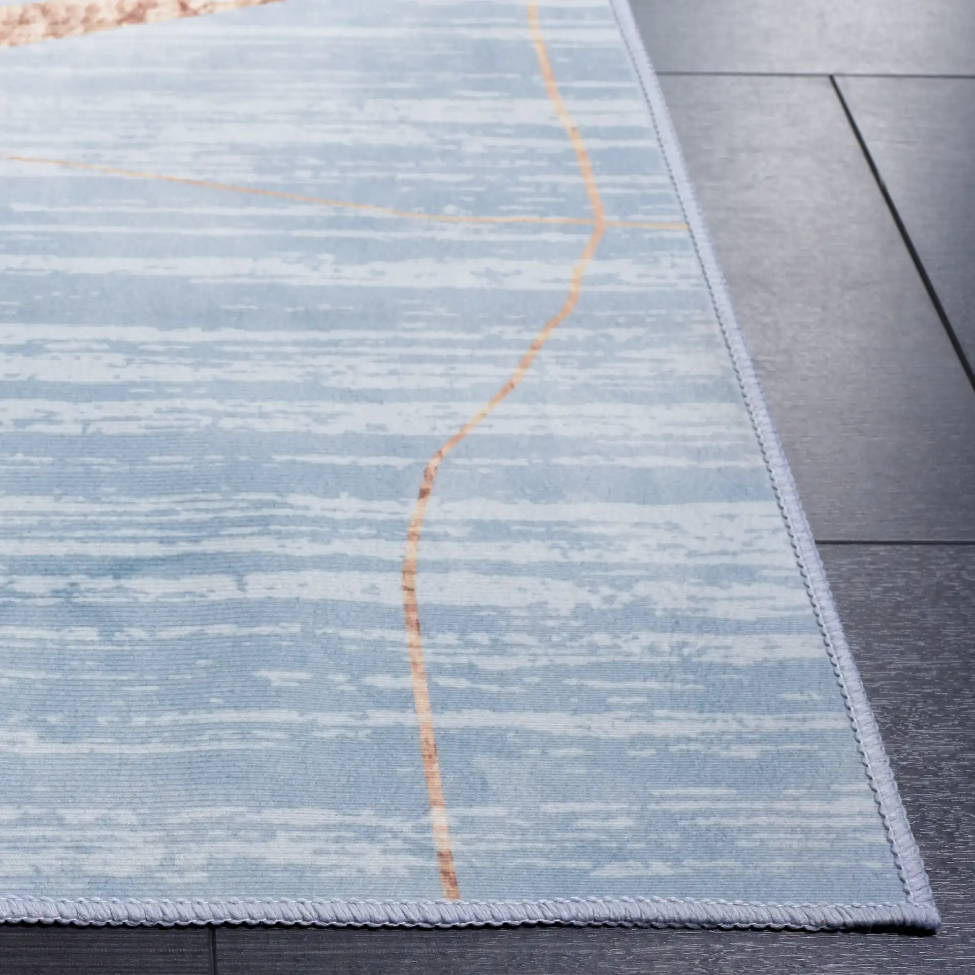 Malibu Modern Abstract Washable Rug in Blue / Gold in a styled room