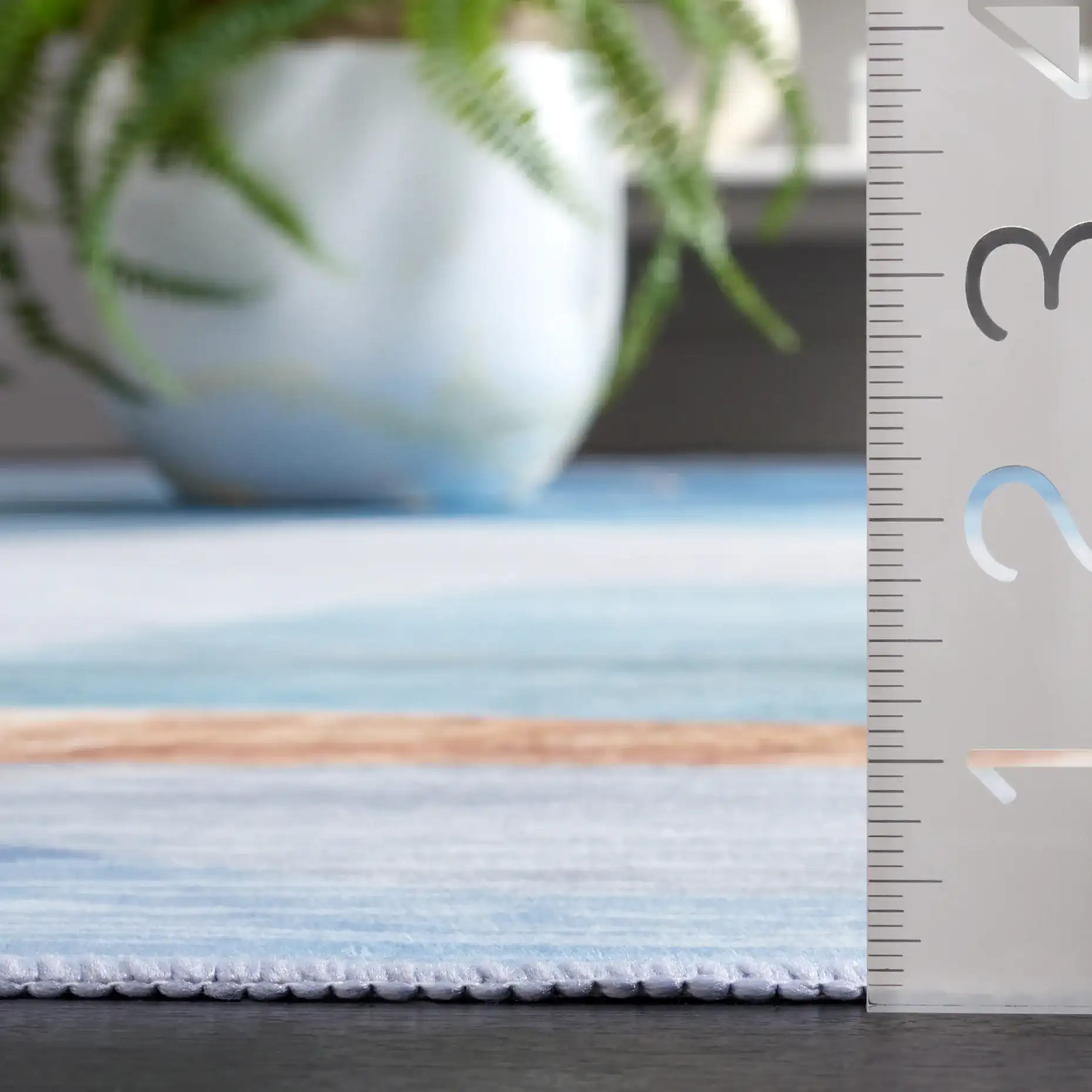 Malibu Modern Abstract Washable Rug in Blue / Gold in a styled room