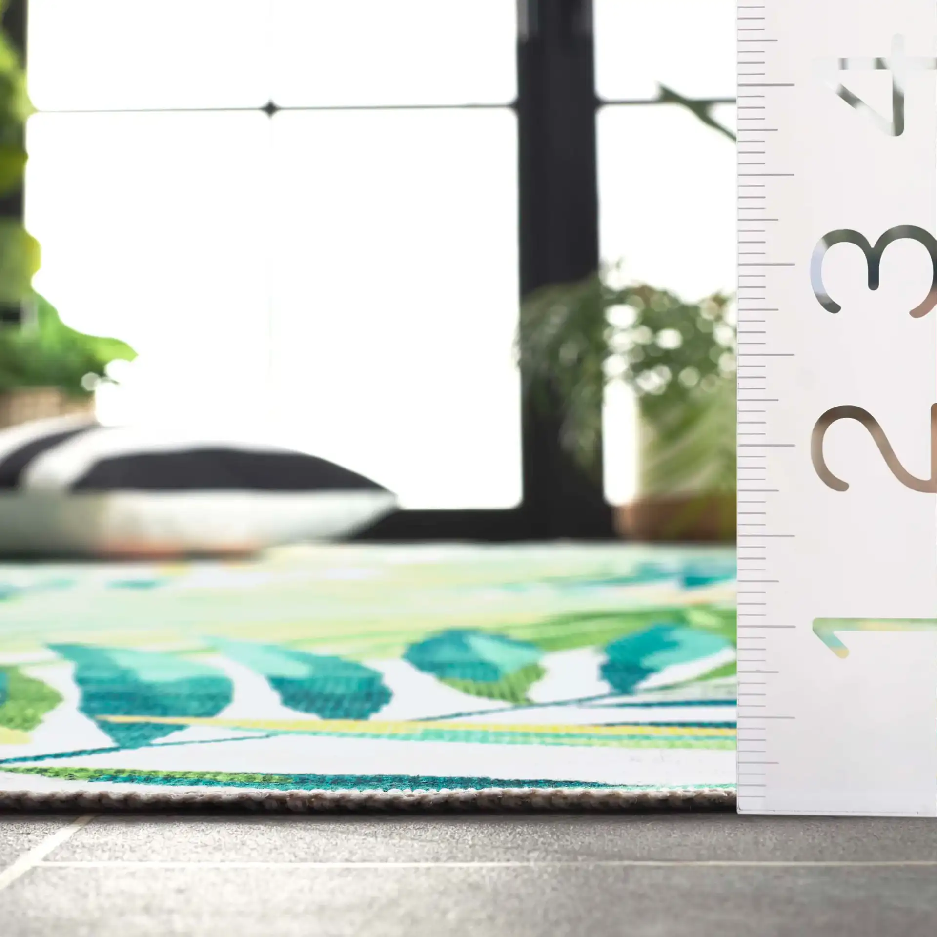 Malibu Tropical Palm Washable Rug in Ivory / Green in a styled room