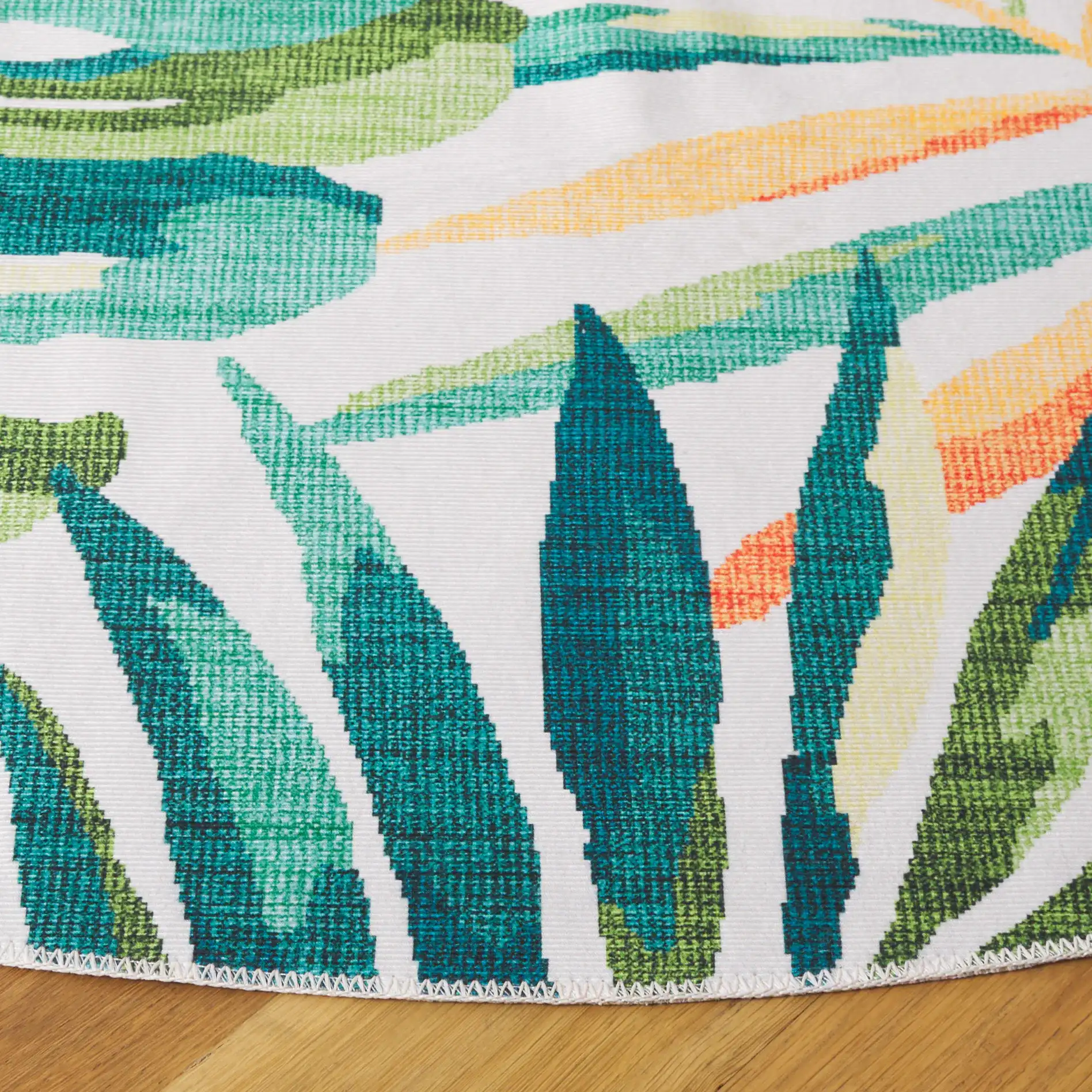 Malibu Tropical Palm Washable Rug in Ivory / Green in a styled room