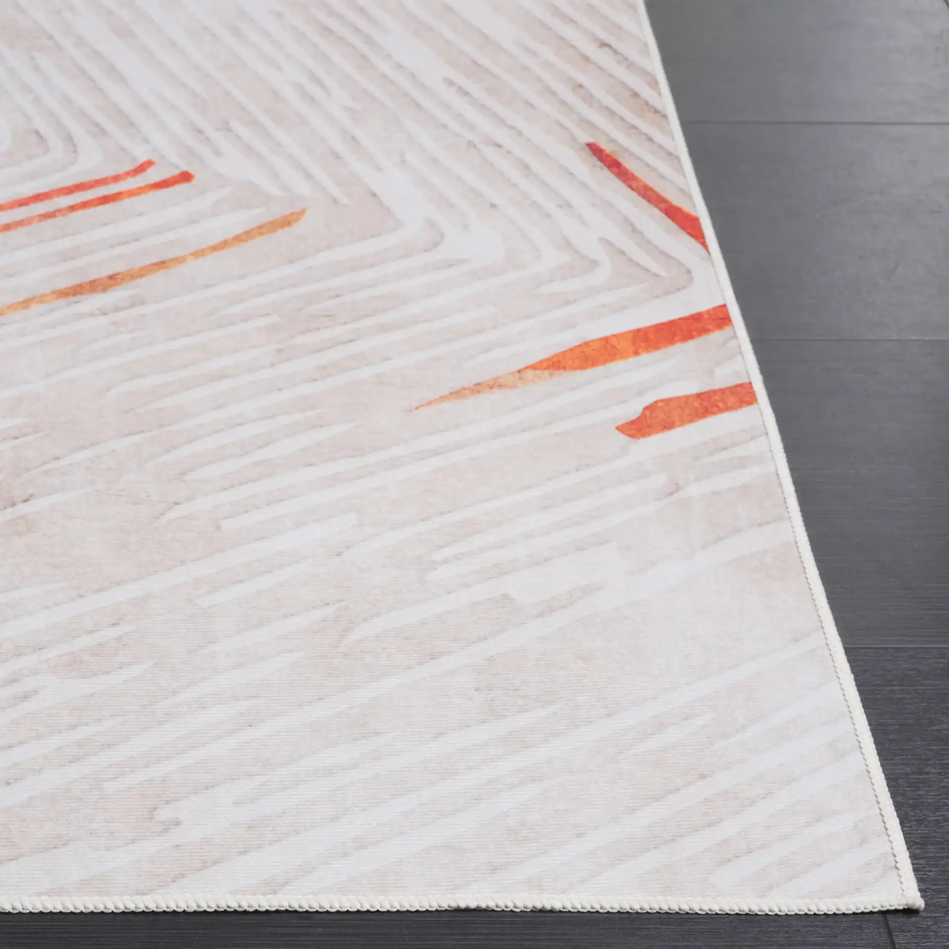 Malibu Concentric Lines Washable Rug in Beige / Rust in a styled room