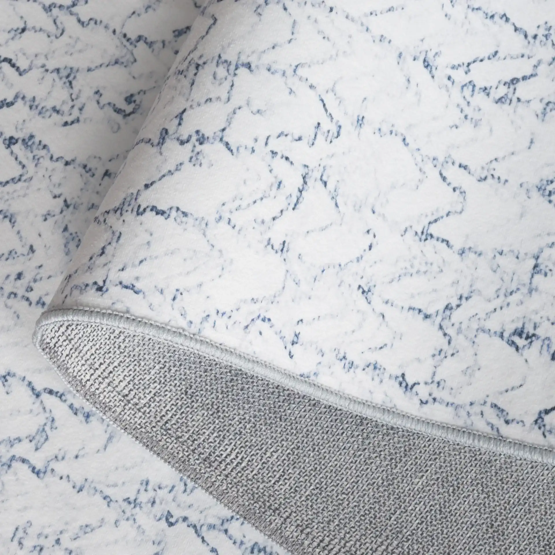 Malibu Sketched Chevron Washable Rug in Gray / Blue in a styled room