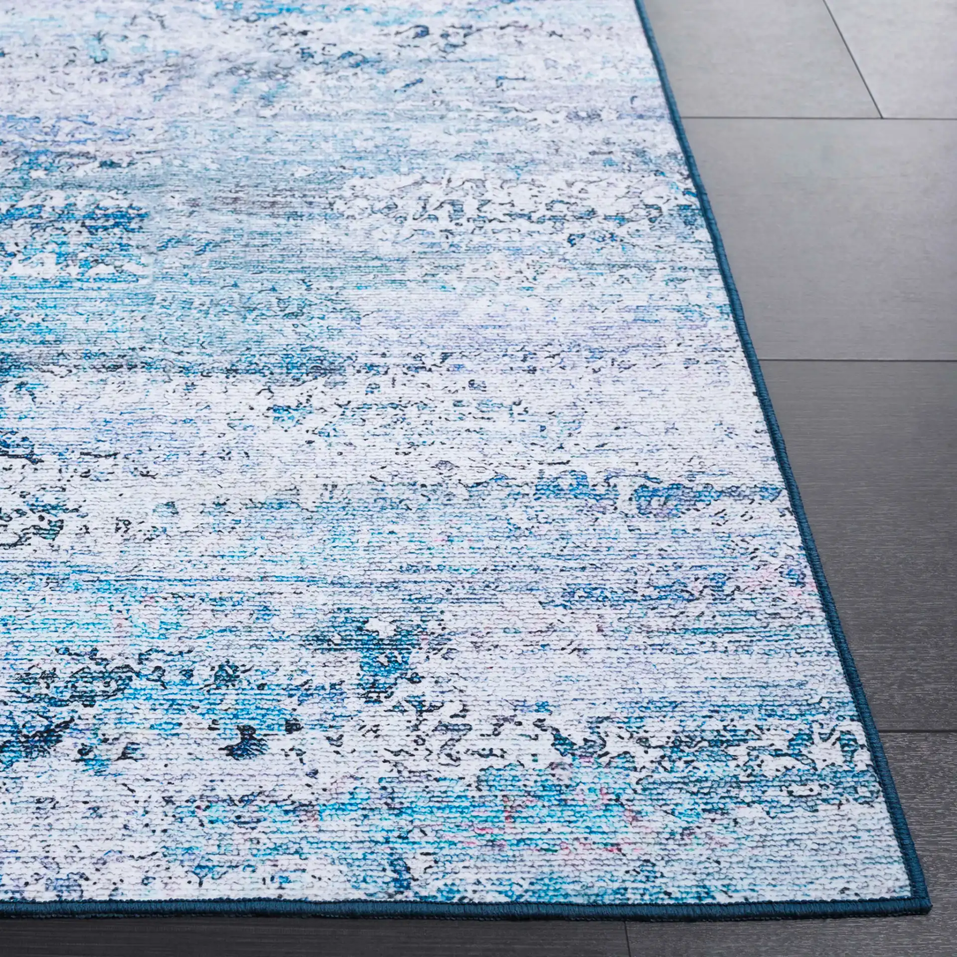 Malibu Faded Abstract Washable Rug in Gray / Blue in a styled room