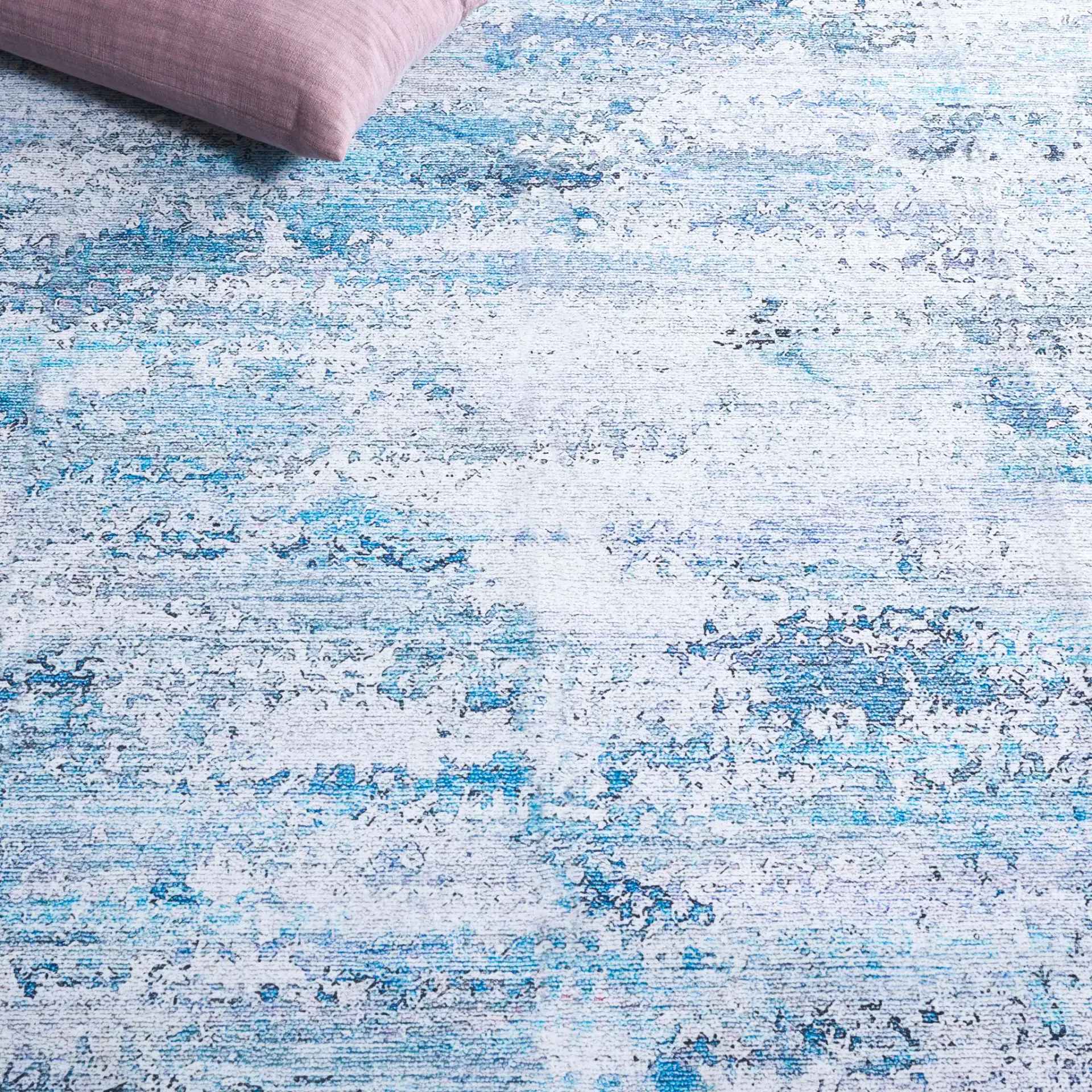 Malibu Faded Abstract Washable Rug in Gray / Blue in a styled room