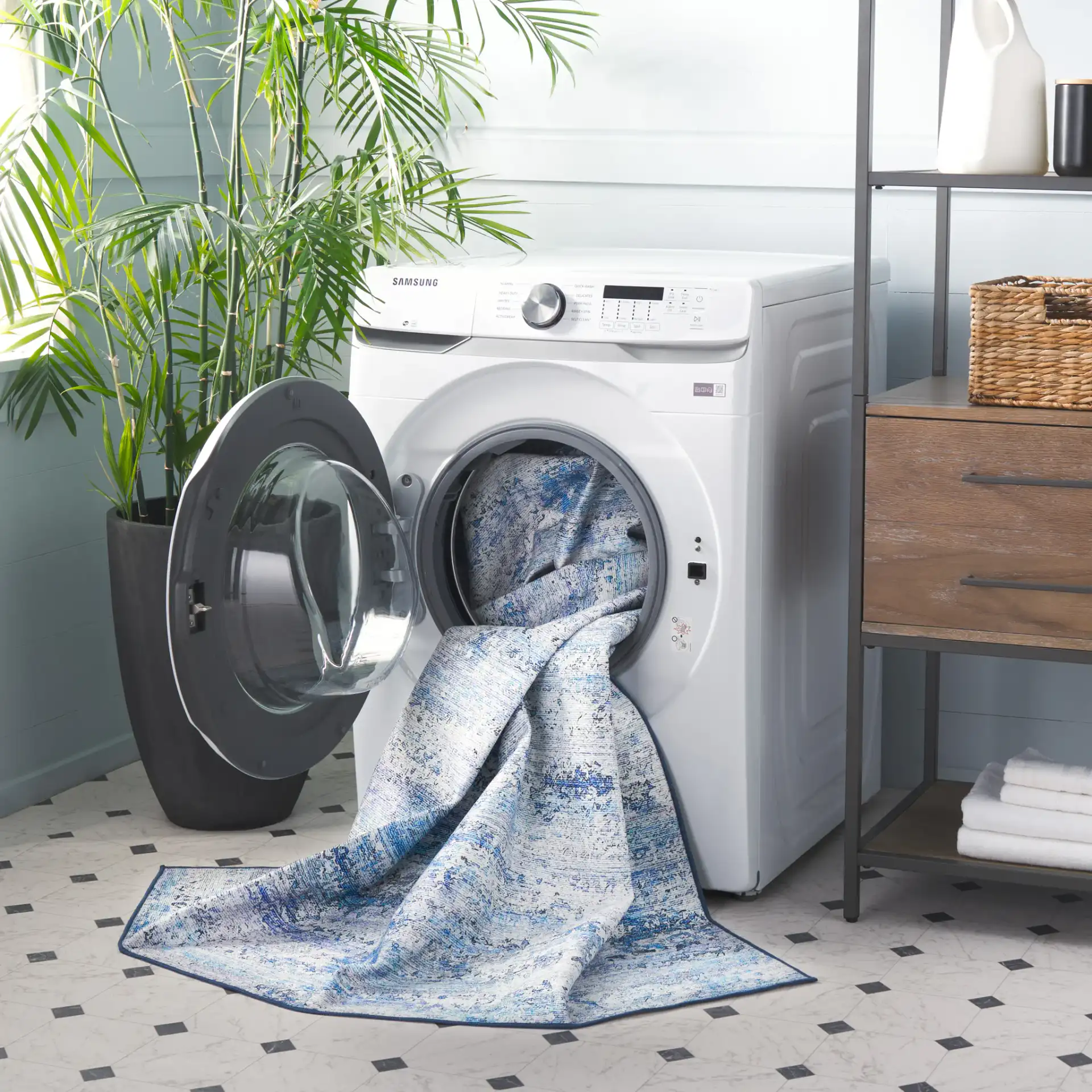 Malibu Faded Abstract Washable Rug in Gray / Blue in a styled room