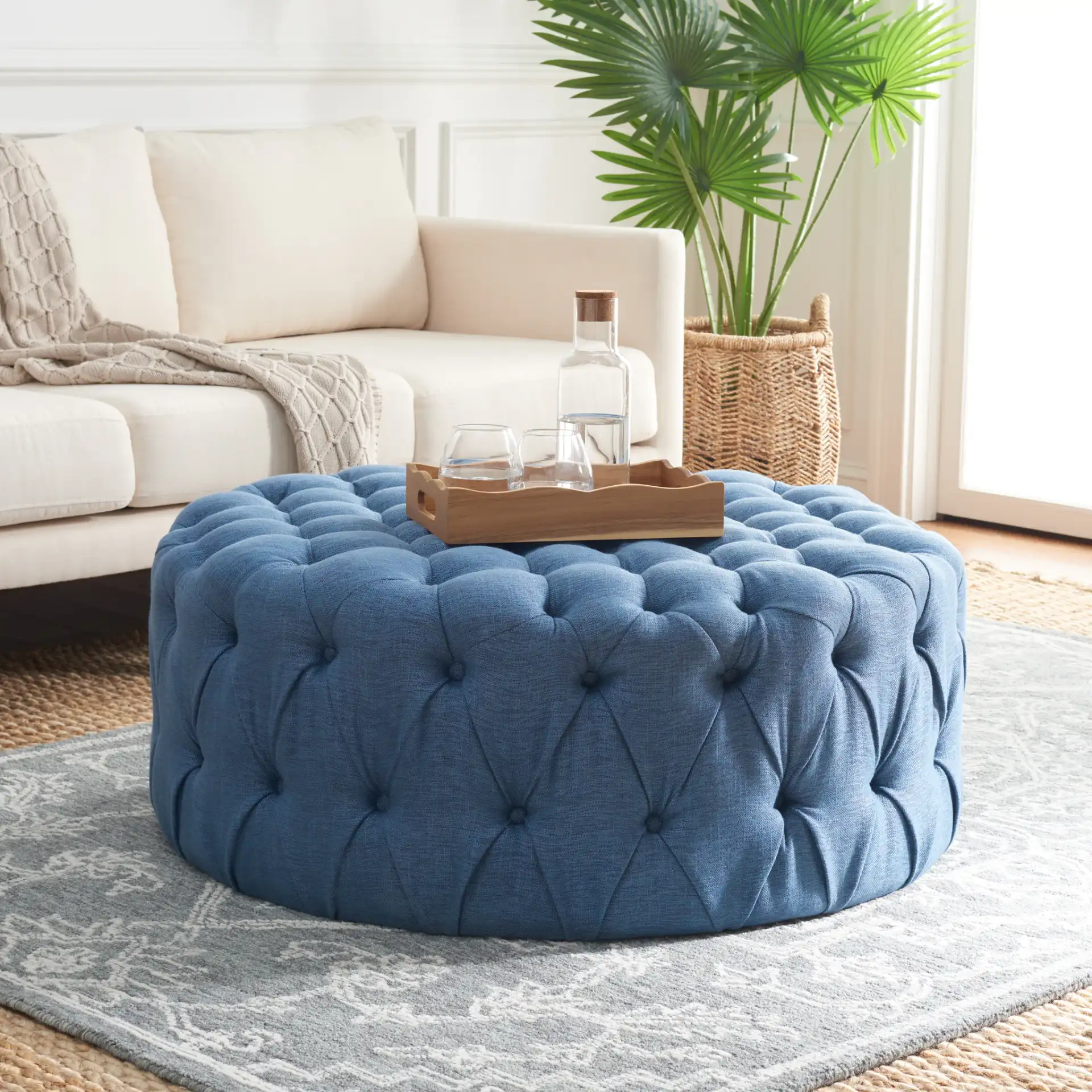 Charlene Ottoman in Navy Blue in a styled room