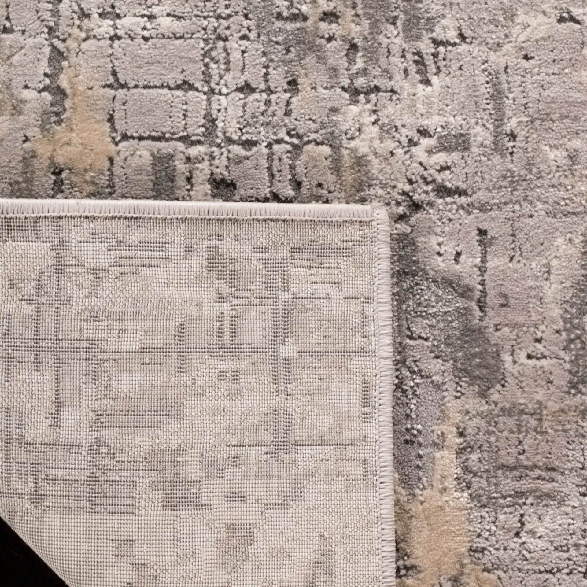 Meadow Abstract Textured Grid Rug in Gray in a styled room