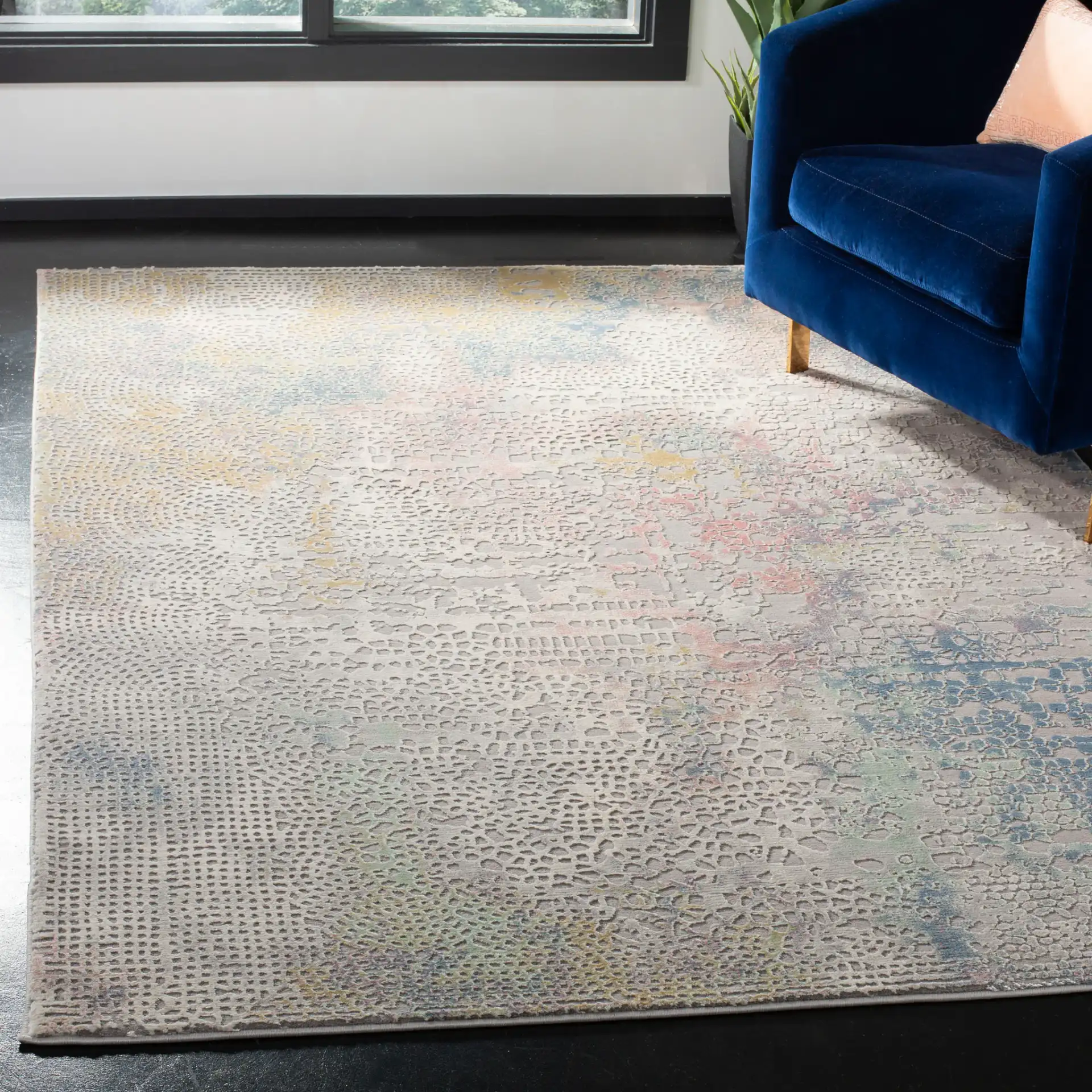 Meadow Textured Dot Abstract Rug in Gray / Gold in a styled room