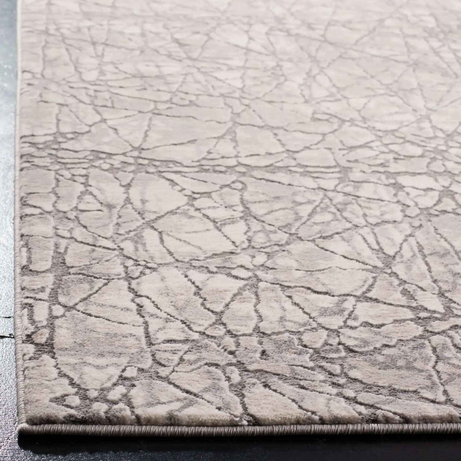 Meadow Intersecting Lines Rug in Beige / Gray in a styled room