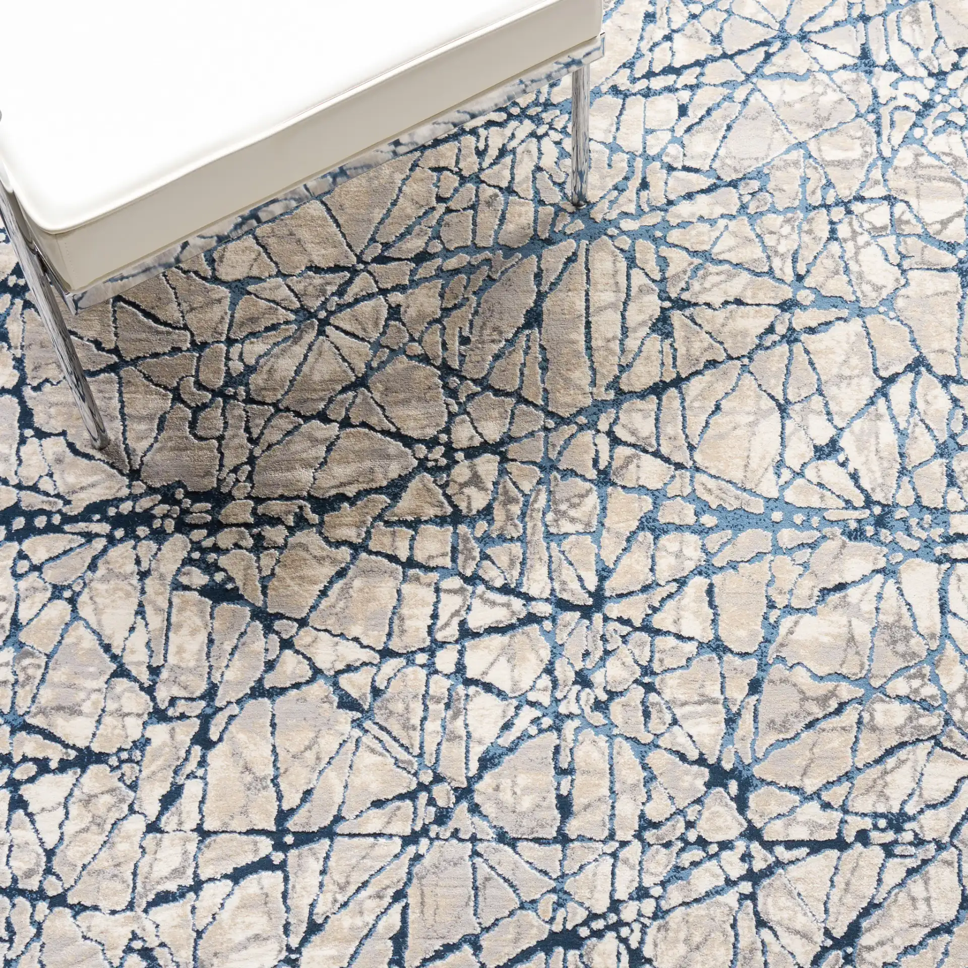 Meadow Intersecting Lines Rug in Navy / Ivory in a styled room