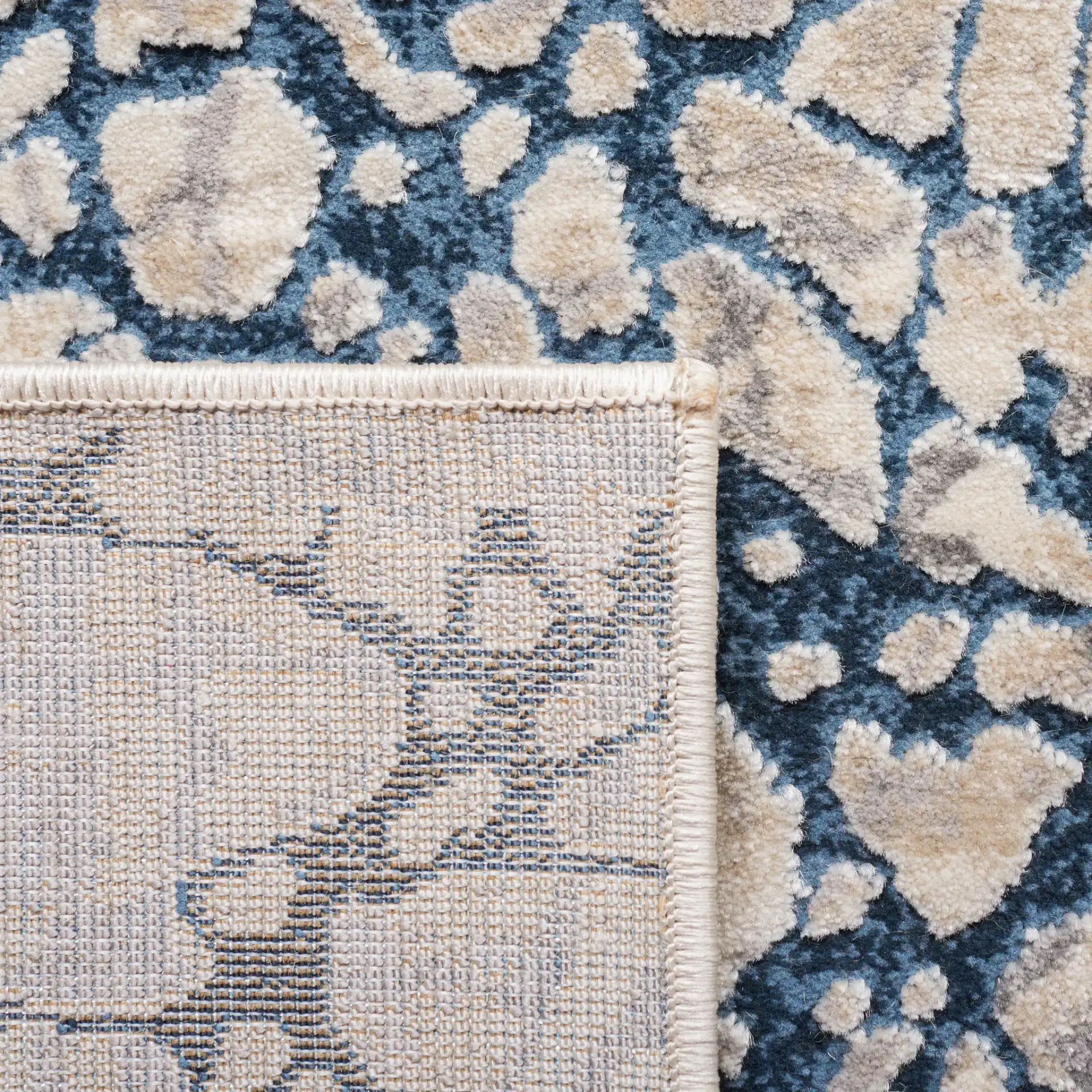 Meadow Intersecting Lines Rug in Navy / Ivory in a styled room