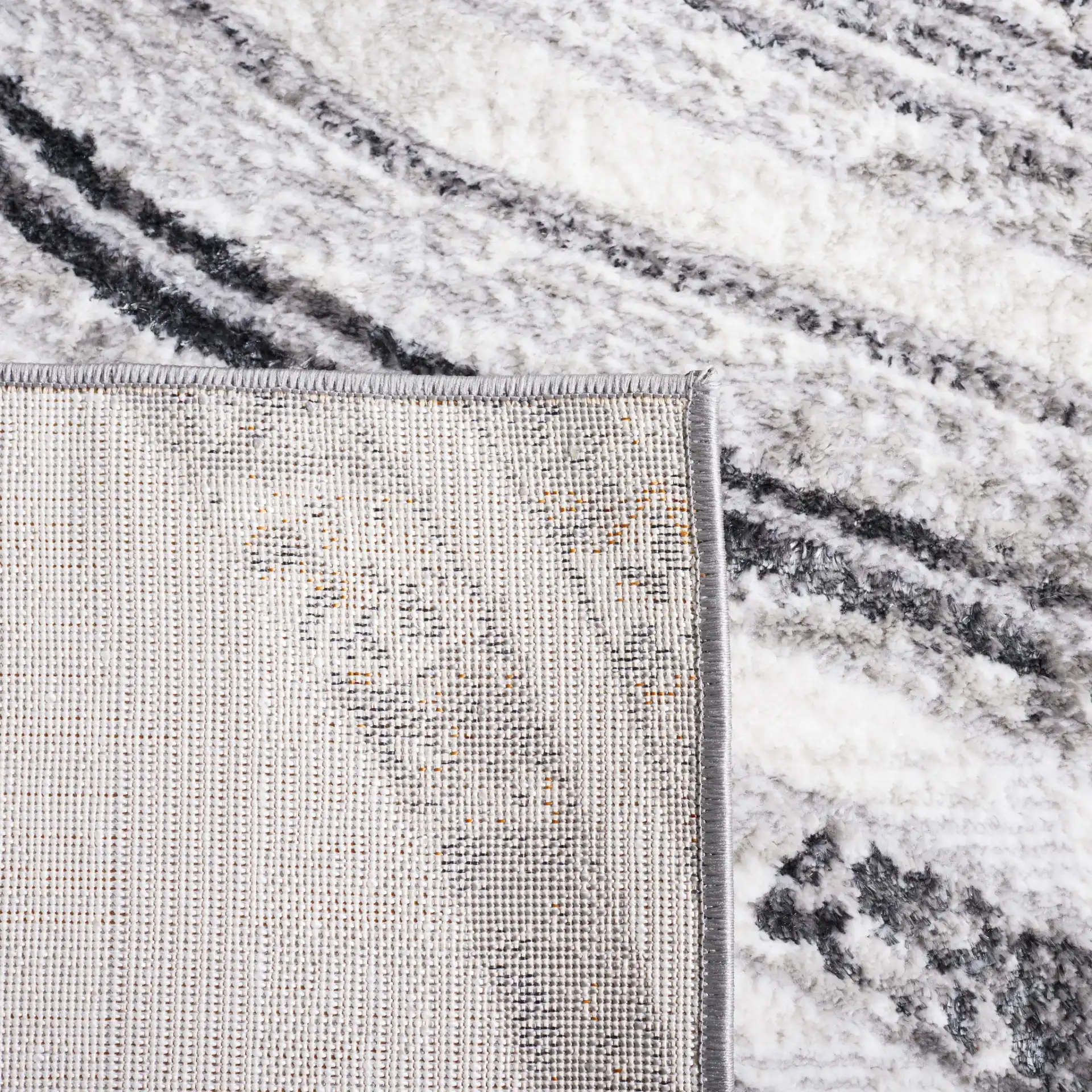 Meadow Marbled Wave Rug in Light Gray / Black in a styled room