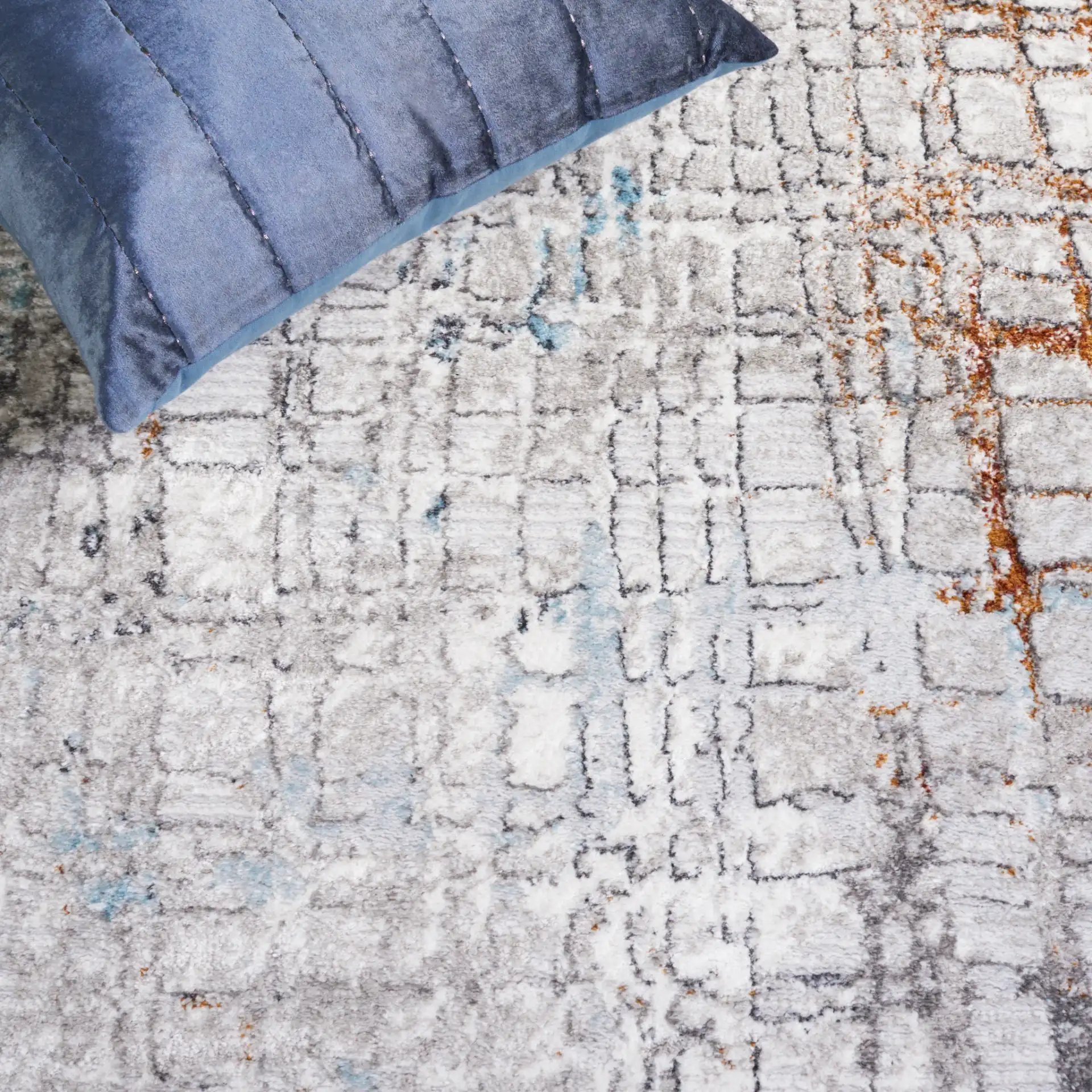 Meadow Distressed Grid Rug in Gray / Blue in a styled room